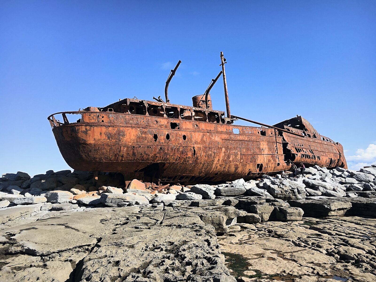 Apple iPhone 6s sample photo. Boat, rocks, rust, rusty photography