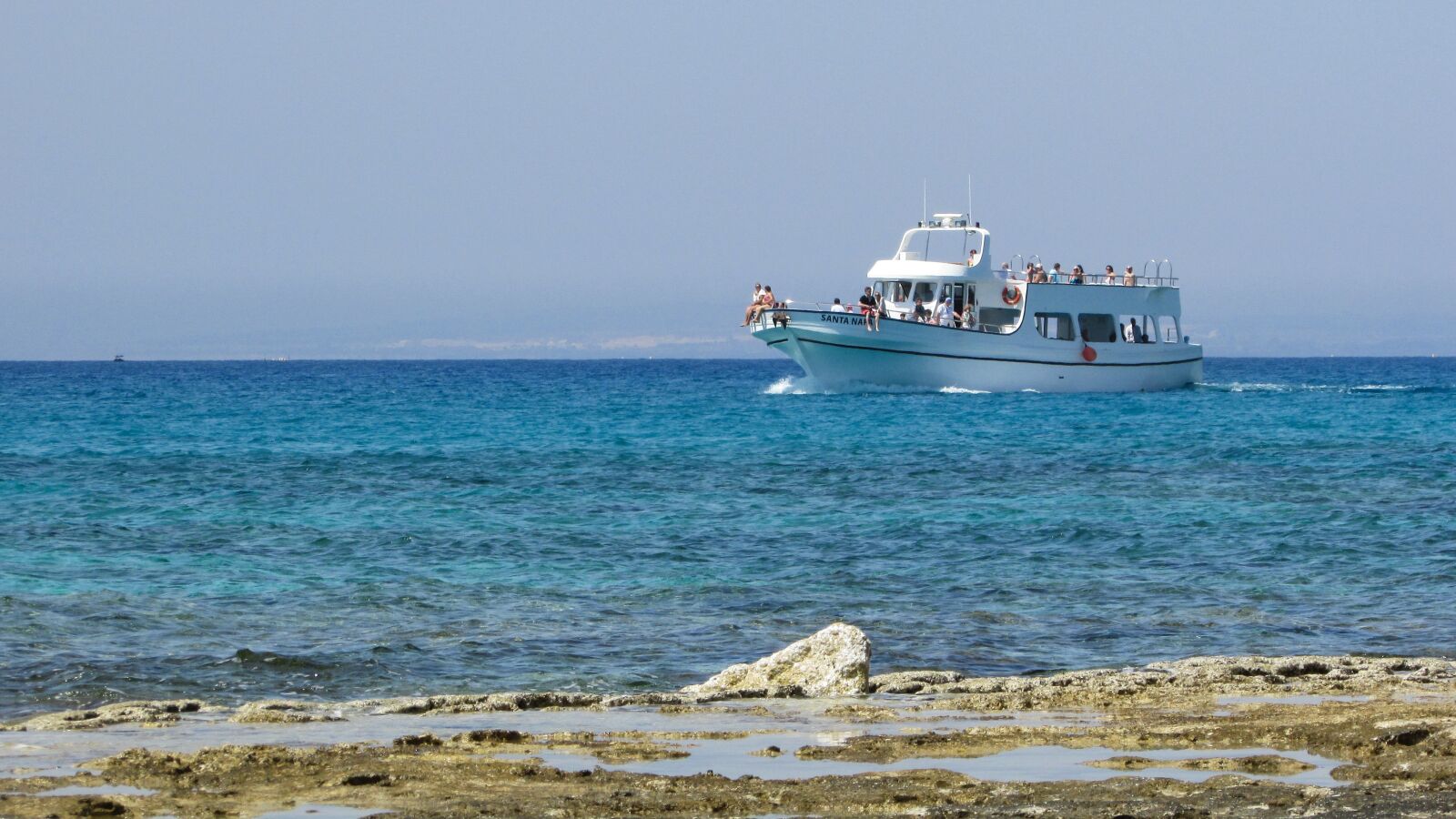 Canon PowerShot SX400 IS sample photo. Cyprus, rocky coast, boat photography