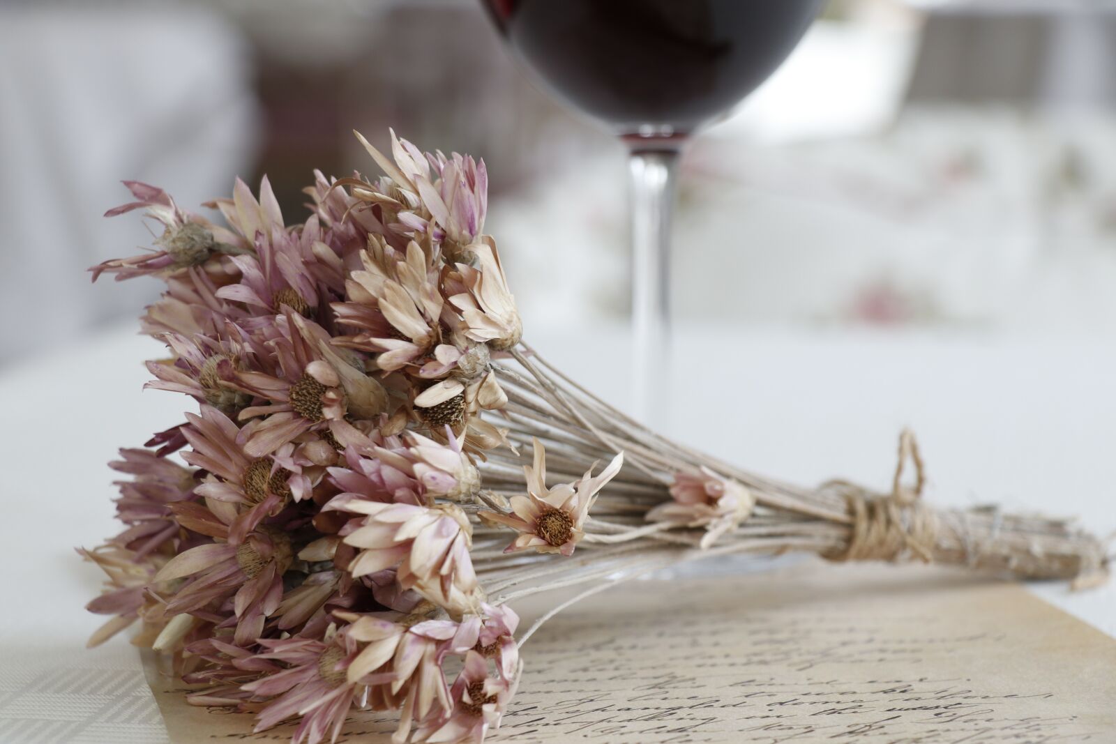Canon EF-S 18-135mm F3.5-5.6 IS USM sample photo. Dry flowers, letters, wine photography