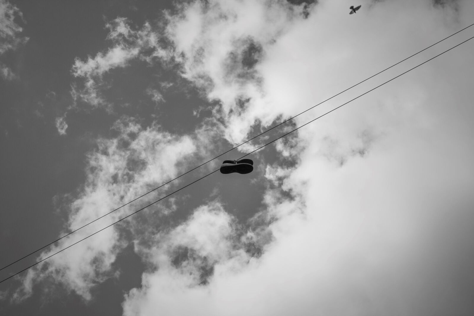 Canon EF-S 24mm F2.8 STM sample photo. Shoes, sky, black white photography
