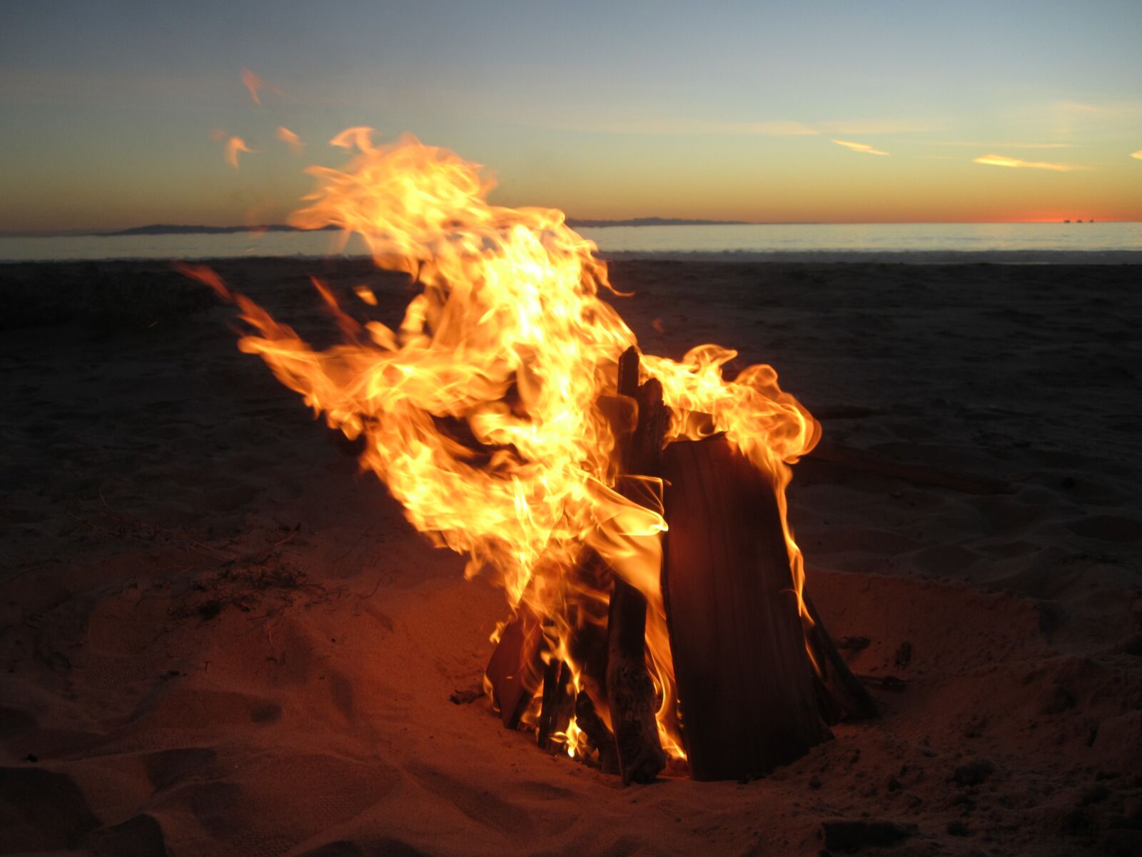 Canon PowerShot SD1400 IS (IXUS 130 / IXY 400F) sample photo. Fire, beach, sunset photography