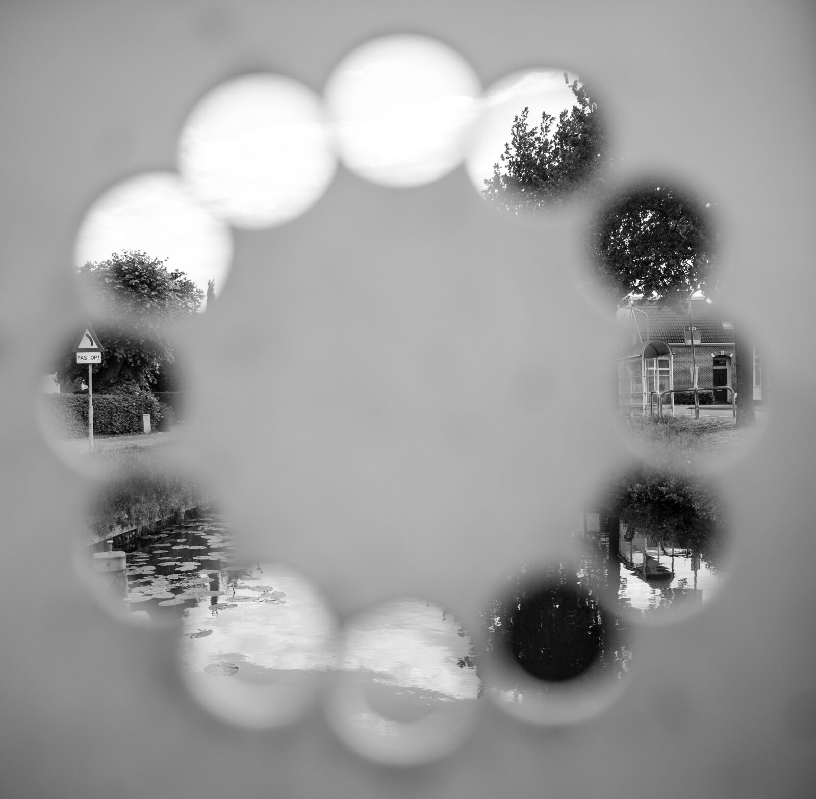 Nikon D600 sample photo. Holes, dial, peek photography