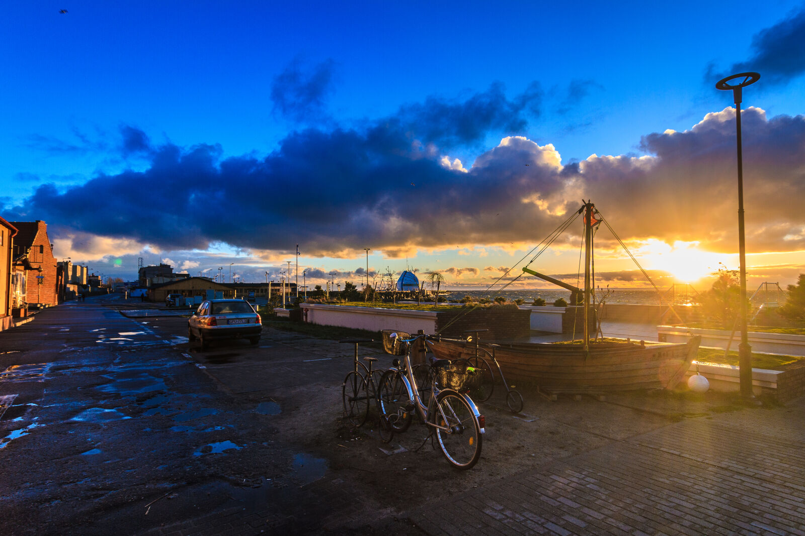 Canon EOS 7D + Tokina AT-X Pro 12-24mm F4 (IF) DX sample photo. Bike, boat, coast, evening photography
