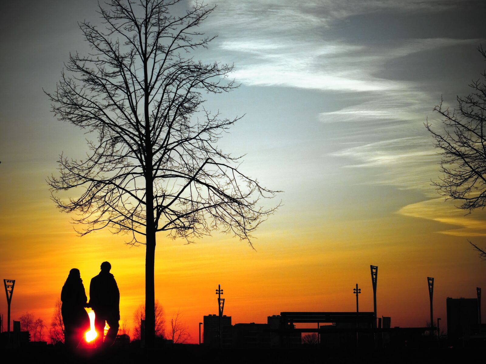 Sony DSC-HX60 sample photo. Backlit, clouds, couple, dark photography