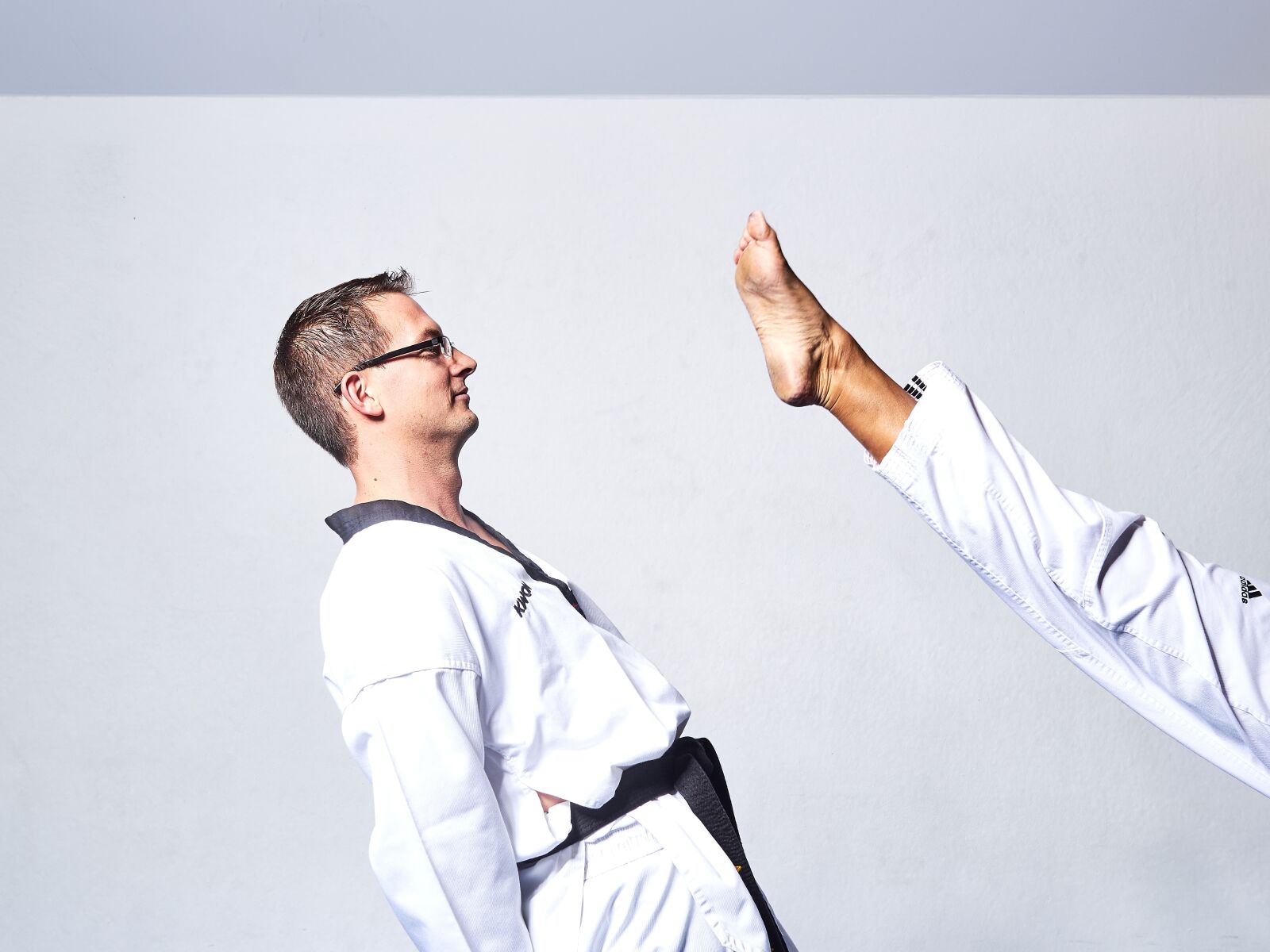 Olympus OM-D E-M1 sample photo. Taekwondo, fight, kick photography