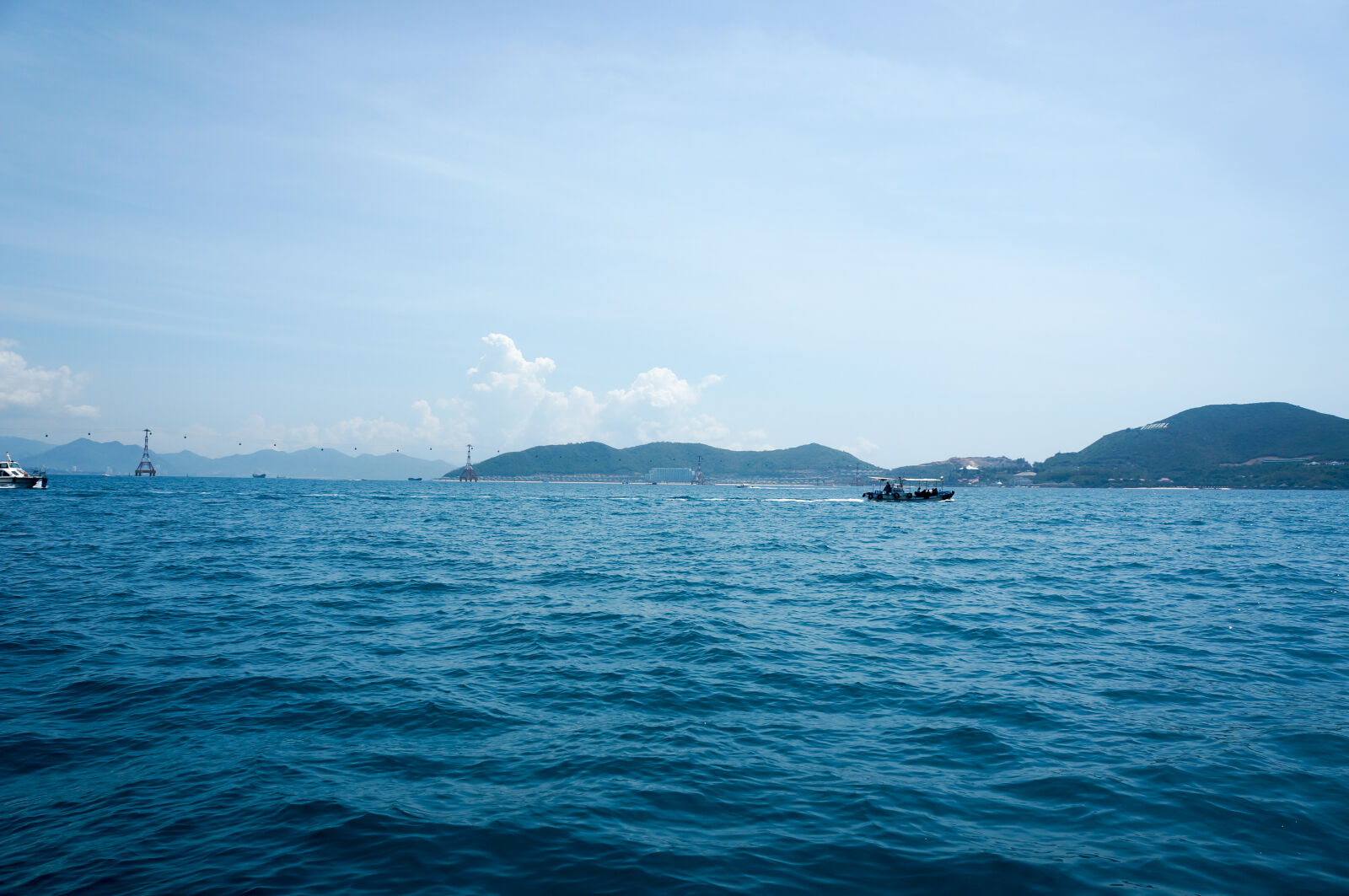 Sony Alpha NEX-5N sample photo. Blue, island, sea, ship photography