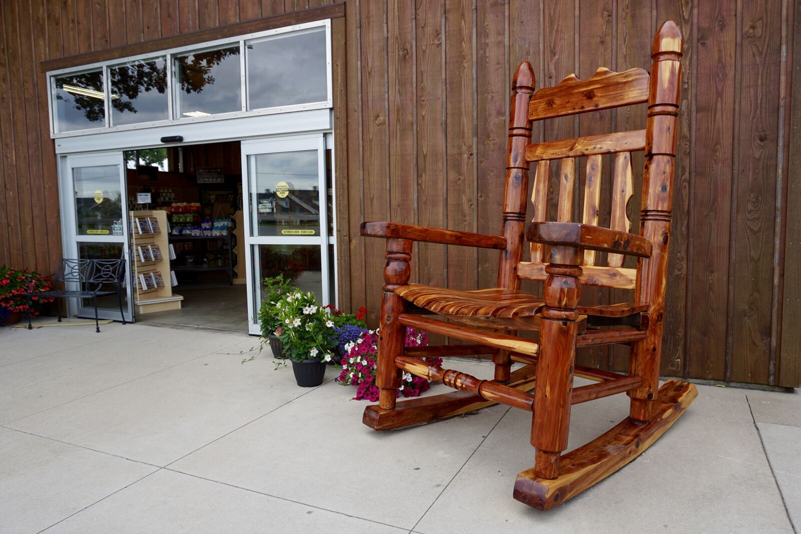 Sony a5100 sample photo. Rocking chair, store front photography