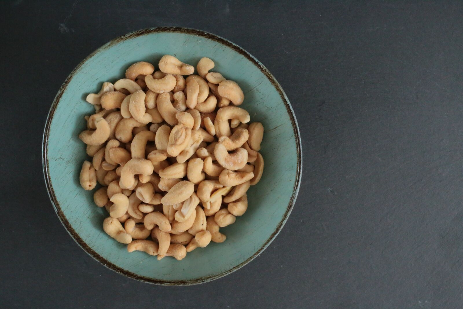 Canon EOS 6D + Canon EF 35mm F2 IS USM sample photo. Cashew, walnut, black background photography