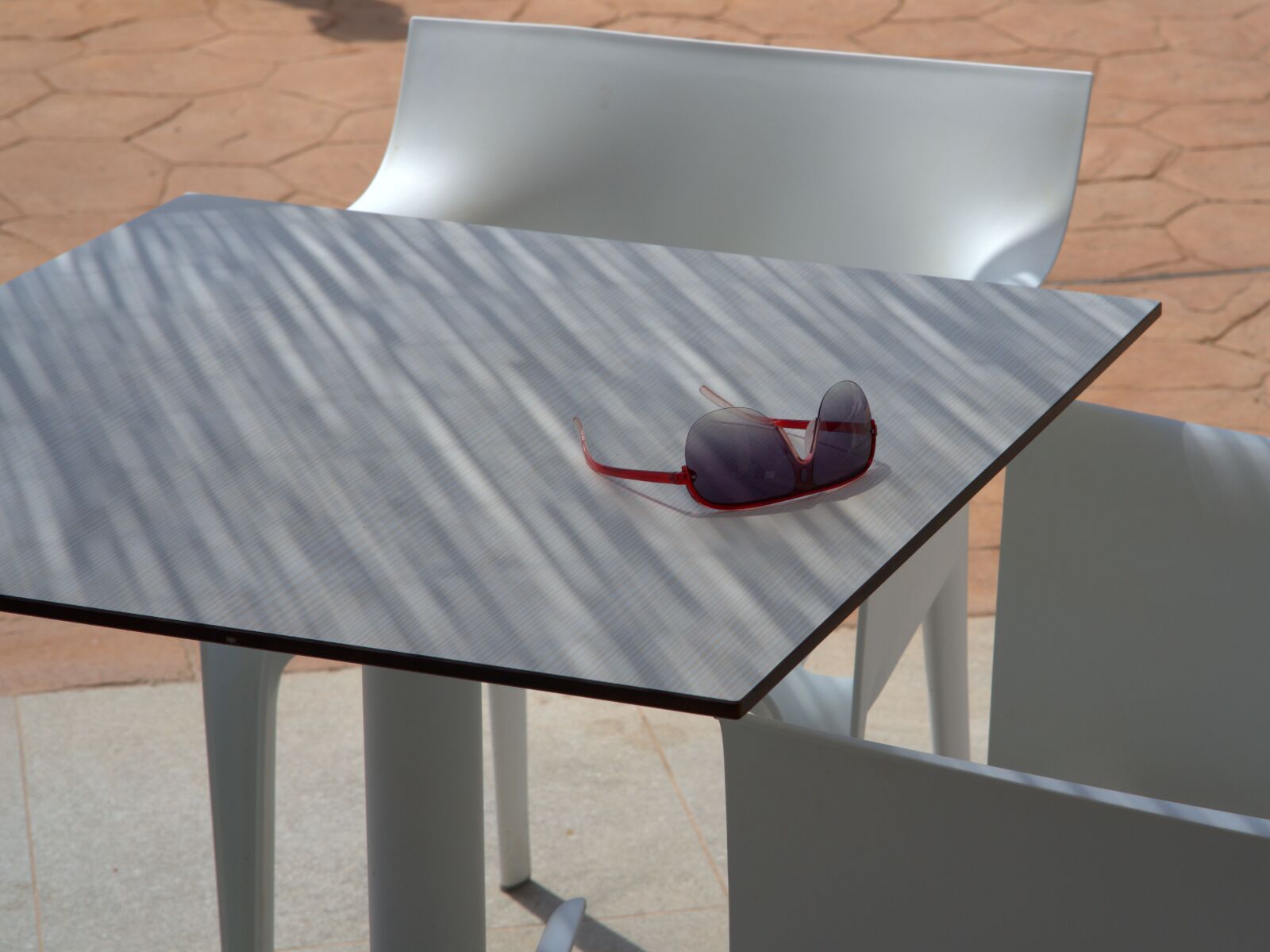Sony a7 II + Sony FE 85mm F1.8 sample photo. Sunglasses, table, shadow photography