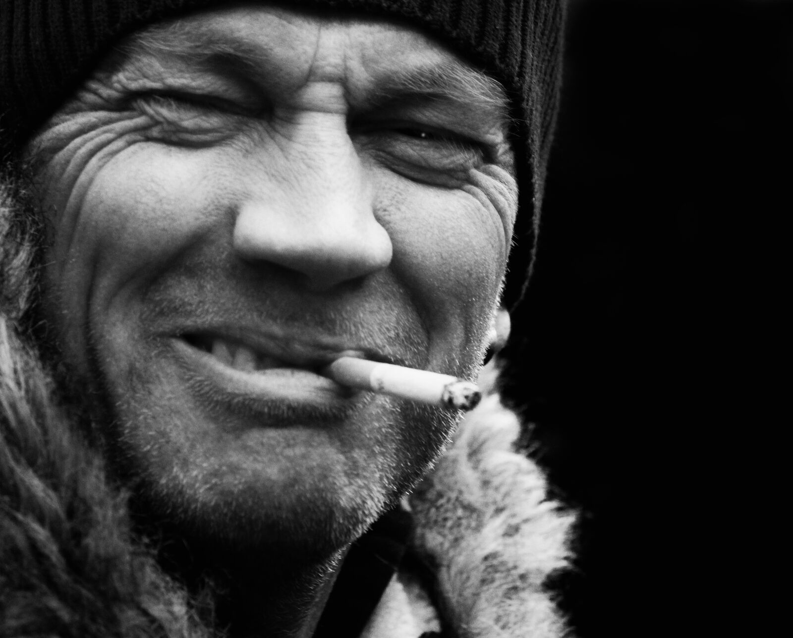 Canon EOS 7D sample photo. Men's face, smoking, black photography