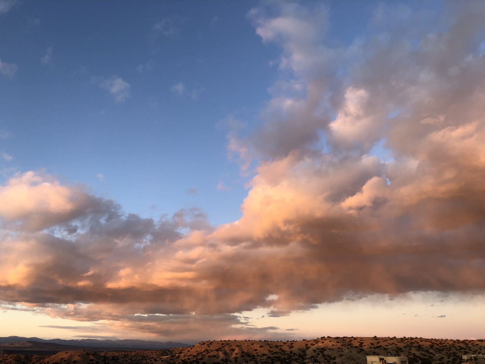 iPhone X back dual camera 4mm f/1.8 sample photo. Clouds, pink, sunset photography