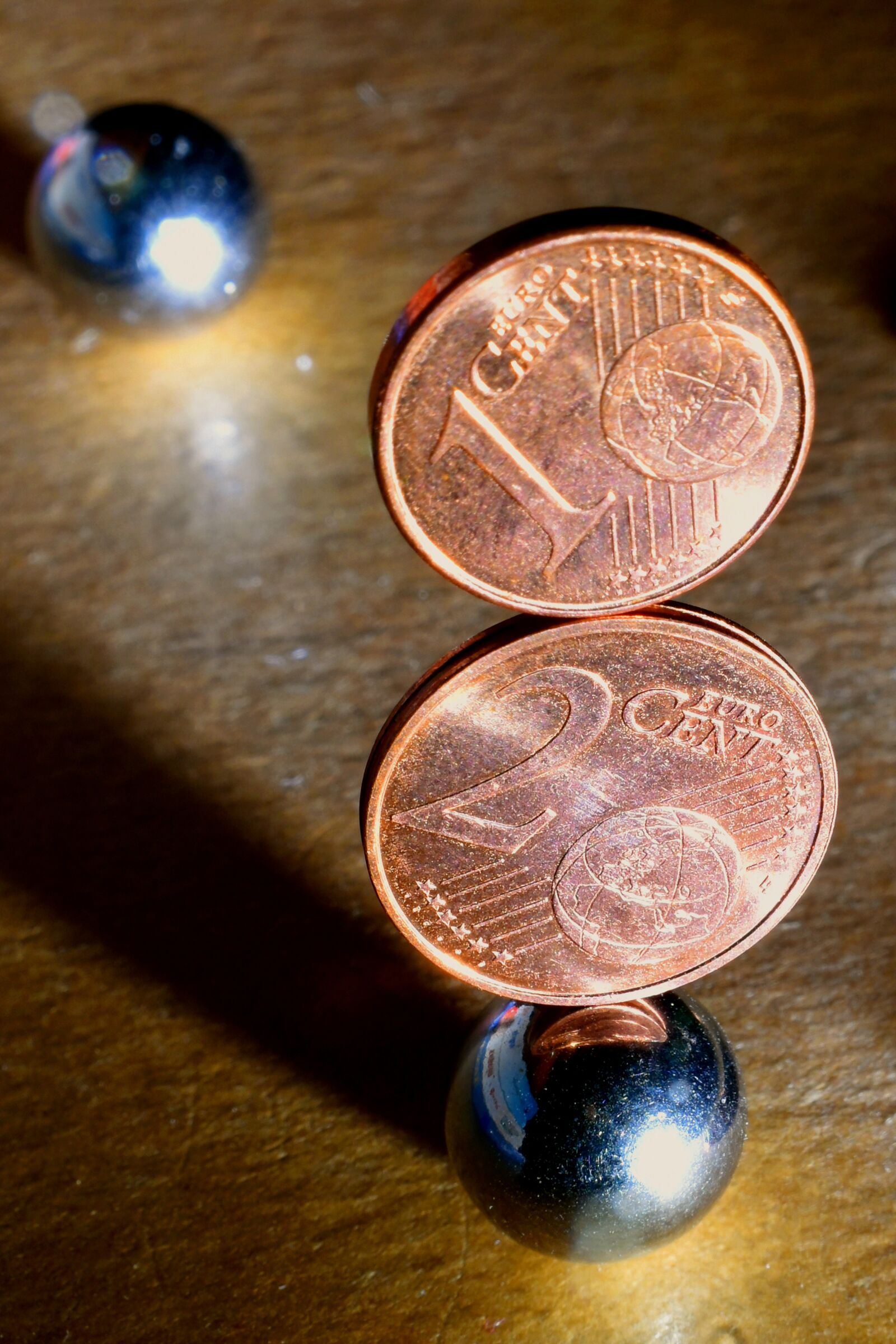 Nikon D3500 sample photo. Illusion, marbles, cents photography
