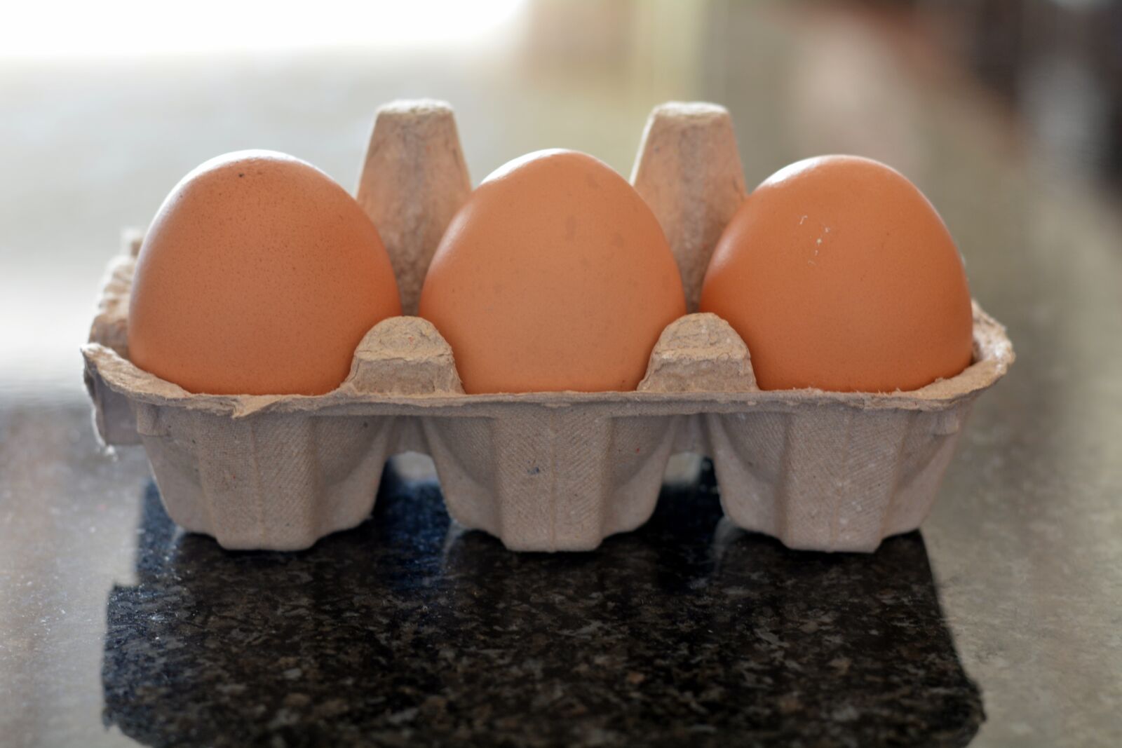 Nikon D5200 sample photo. Egg container, three eggs photography