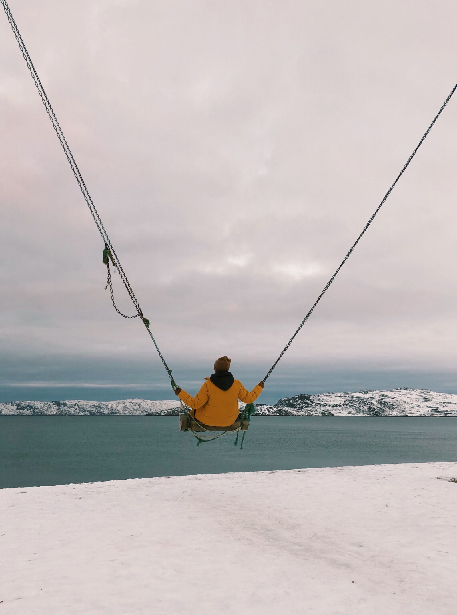 iPhone X back dual camera 4mm f/1.8 sample photo. North, snow, swing photography