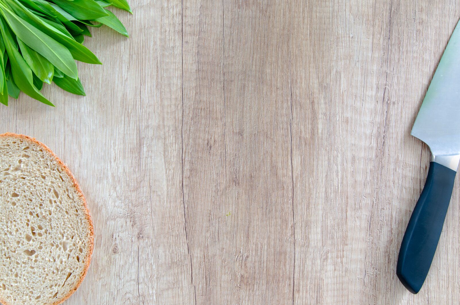 Nikon D5100 sample photo. Bear's garlic, bread, knife photography
