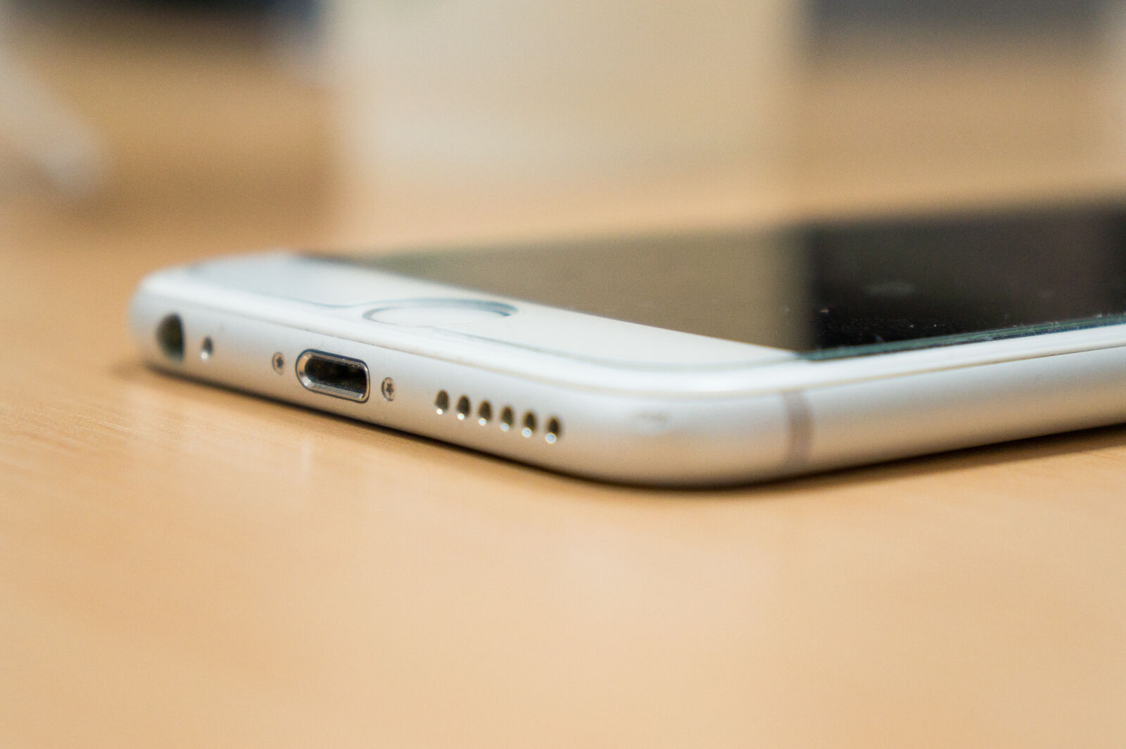 Sony Alpha a3000 sample photo. Bottom, charger, desk, iphone photography