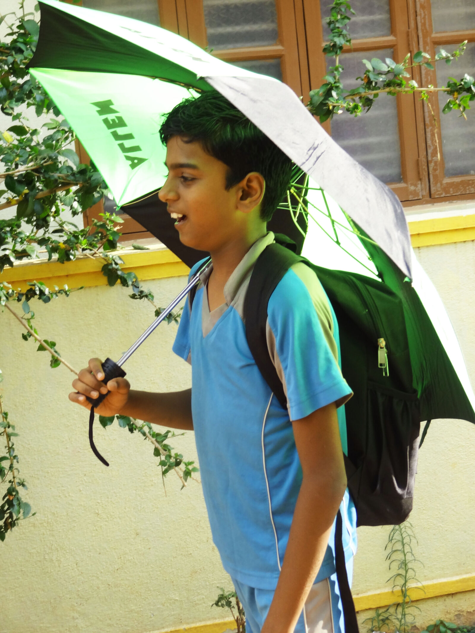 Sony Cyber-shot DSC-HX9V sample photo. Boy, walking, with, umbrella photography