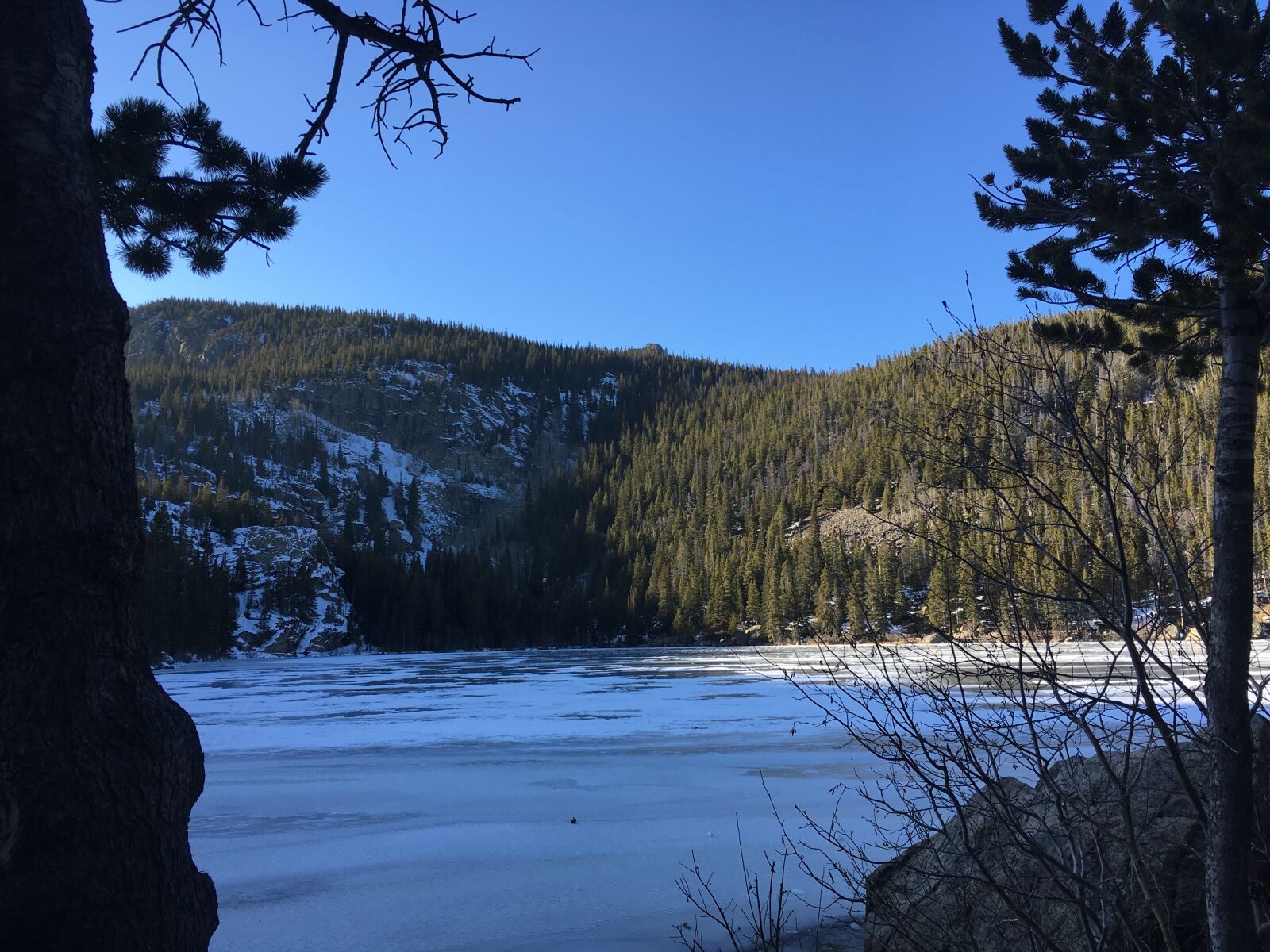 Apple iPhone SE sample photo. Mountain, frozen, lake, trees photography