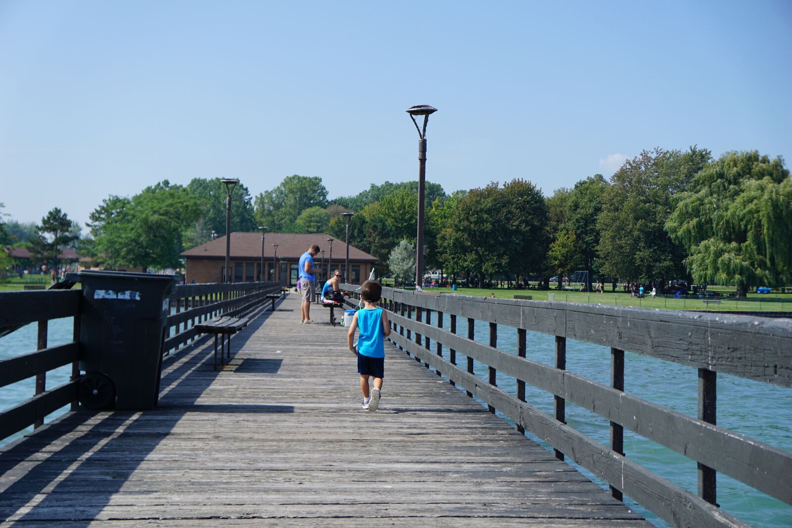 Sony a6000 + Sony E 18-55mm F3.5-5.6 OSS sample photo. Boy, toddler, pier photography