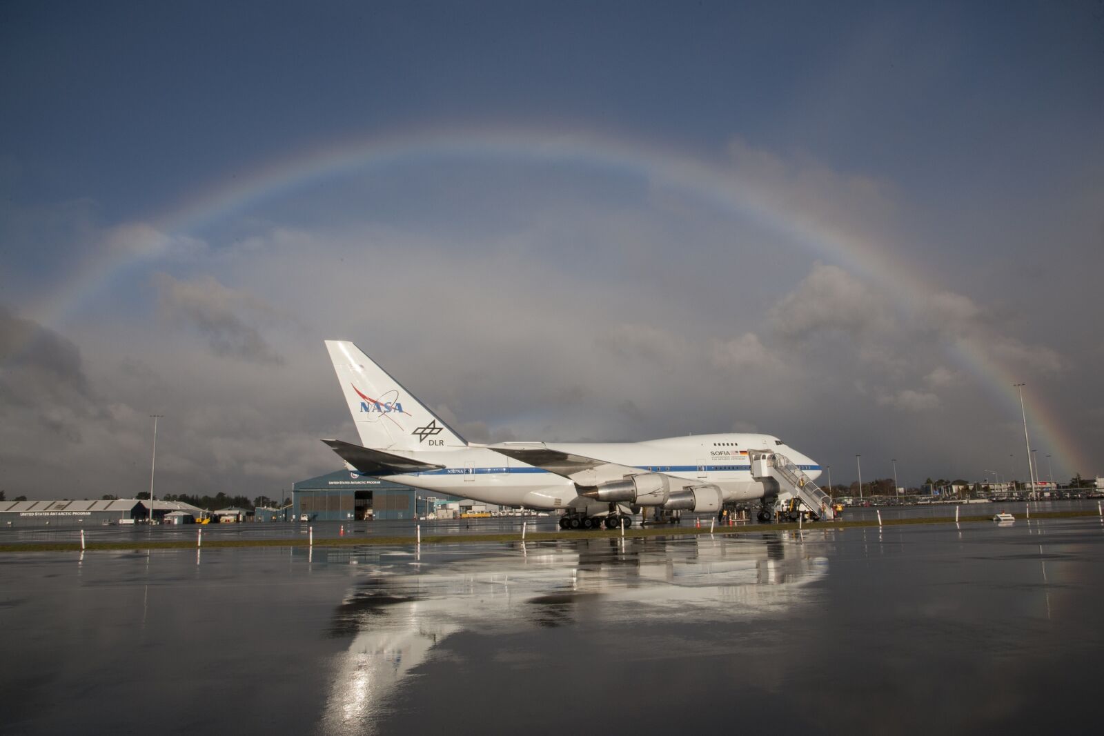 Nikon D3X sample photo. Jetliner, rainbow, boeing 747sp photography