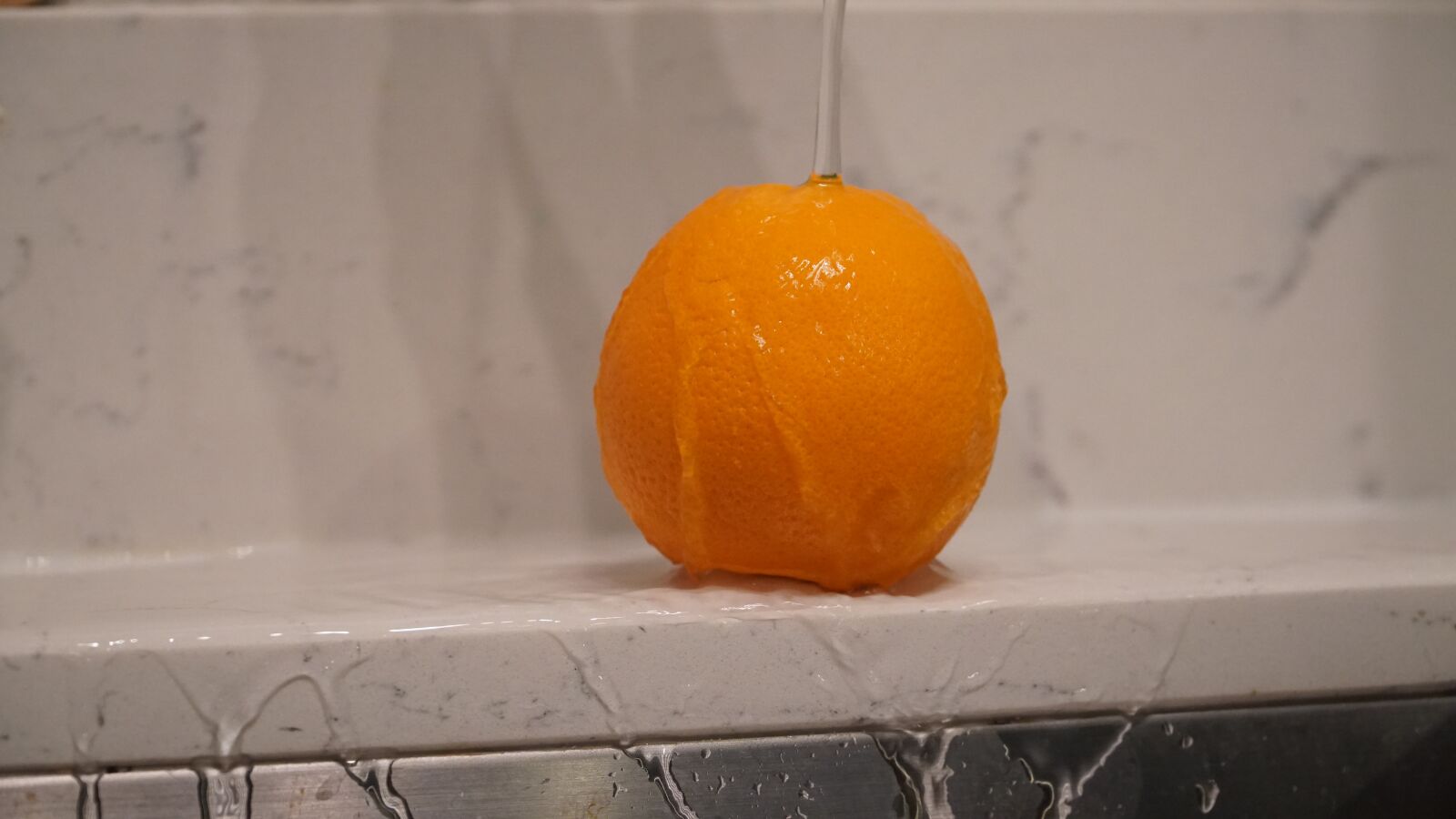 Sony E PZ 18-105mm F4 G OSS sample photo. Orange, fruits, water photography