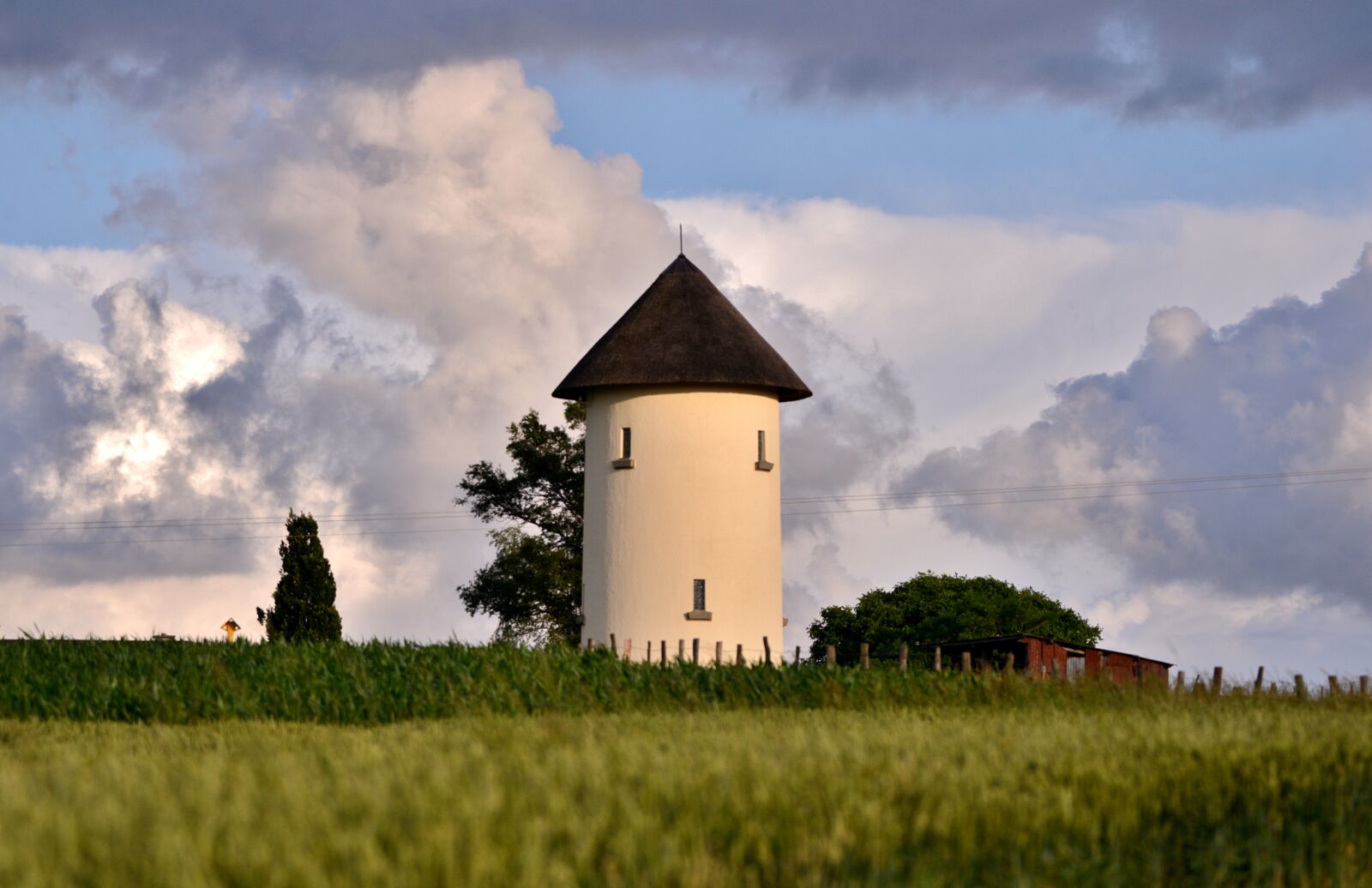 Nikon D600 sample photo. Water tower, cloudy sky photography