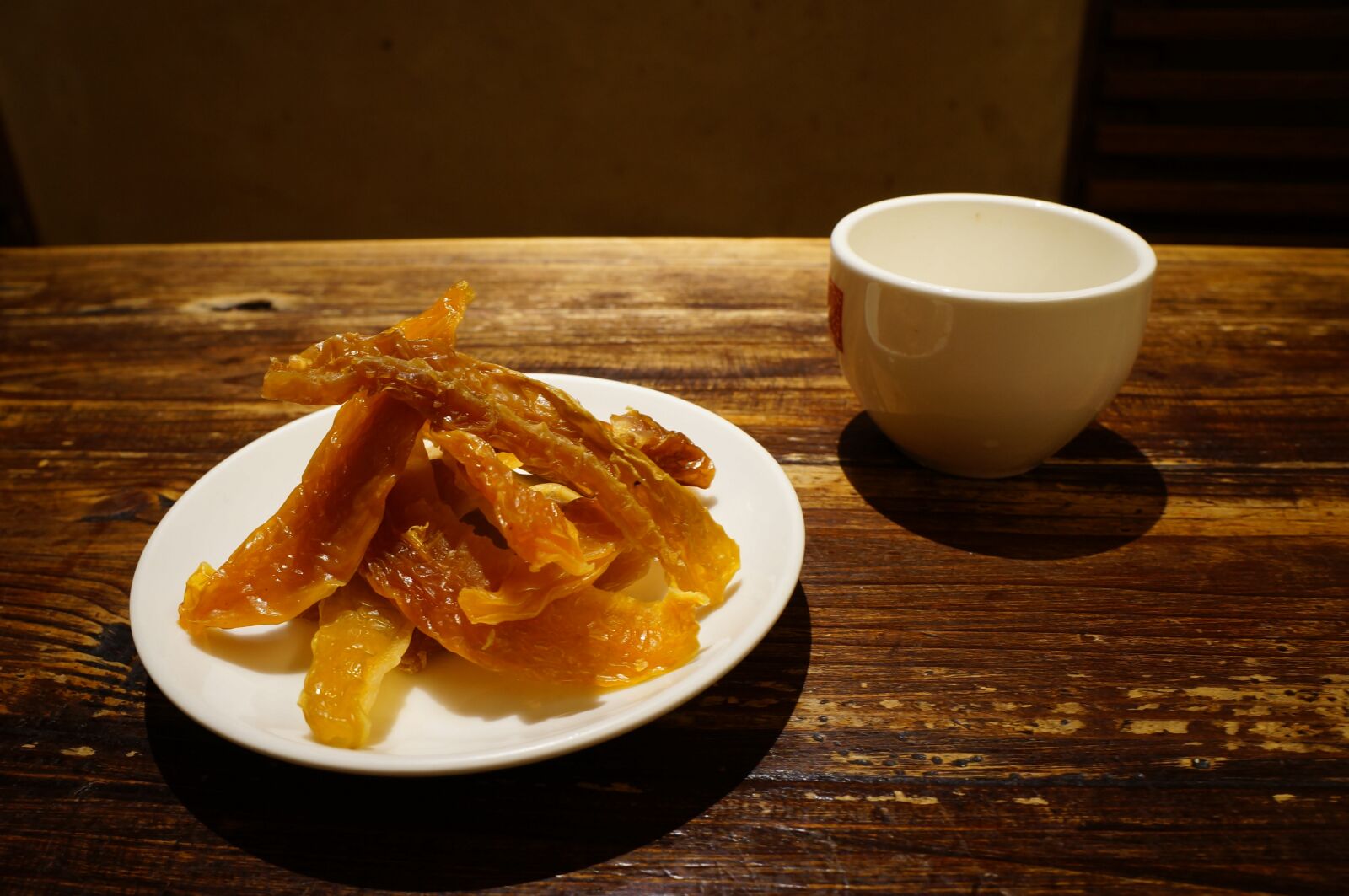 Sony Alpha NEX-F3 + Sony E 18-55mm F3.5-5.6 OSS sample photo. Dried fruit, tea, dim photography
