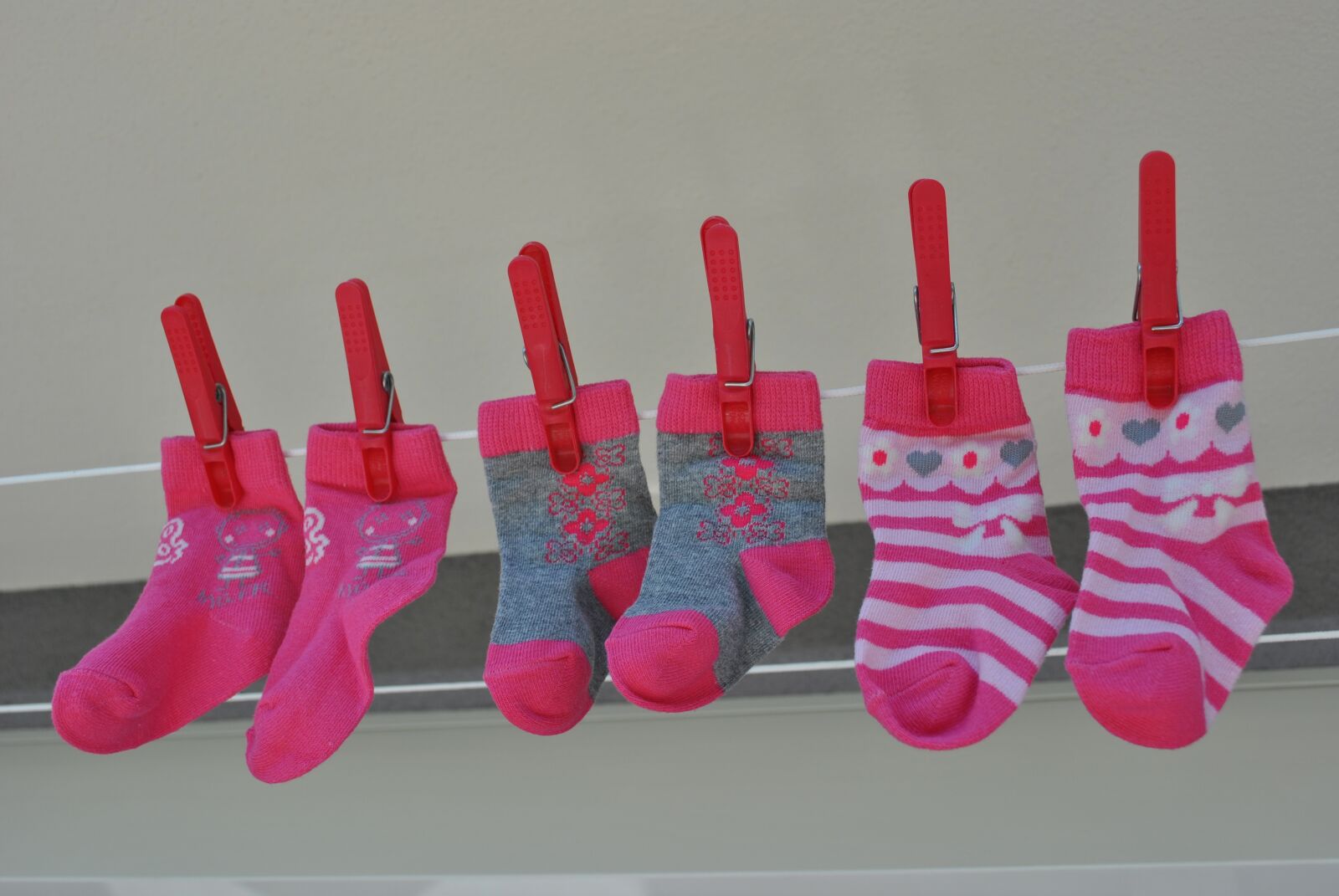 Nikon D3000 sample photo. Socks, pink, baby photography
