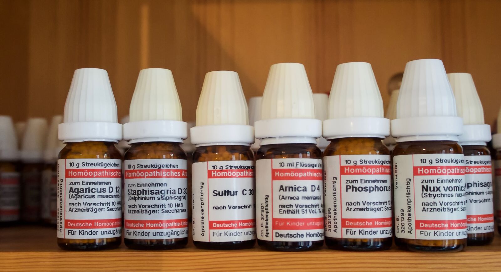 Olympus OM-D E-M10 sample photo. Homeopathy, globuli, scattering beads photography