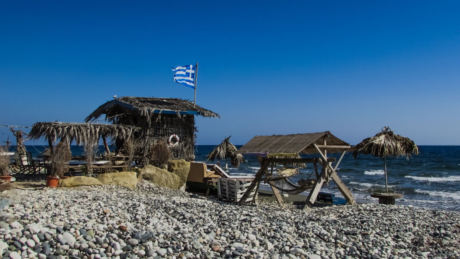 Canon PowerShot SX400 IS sample photo. Hut, rough, beach photography