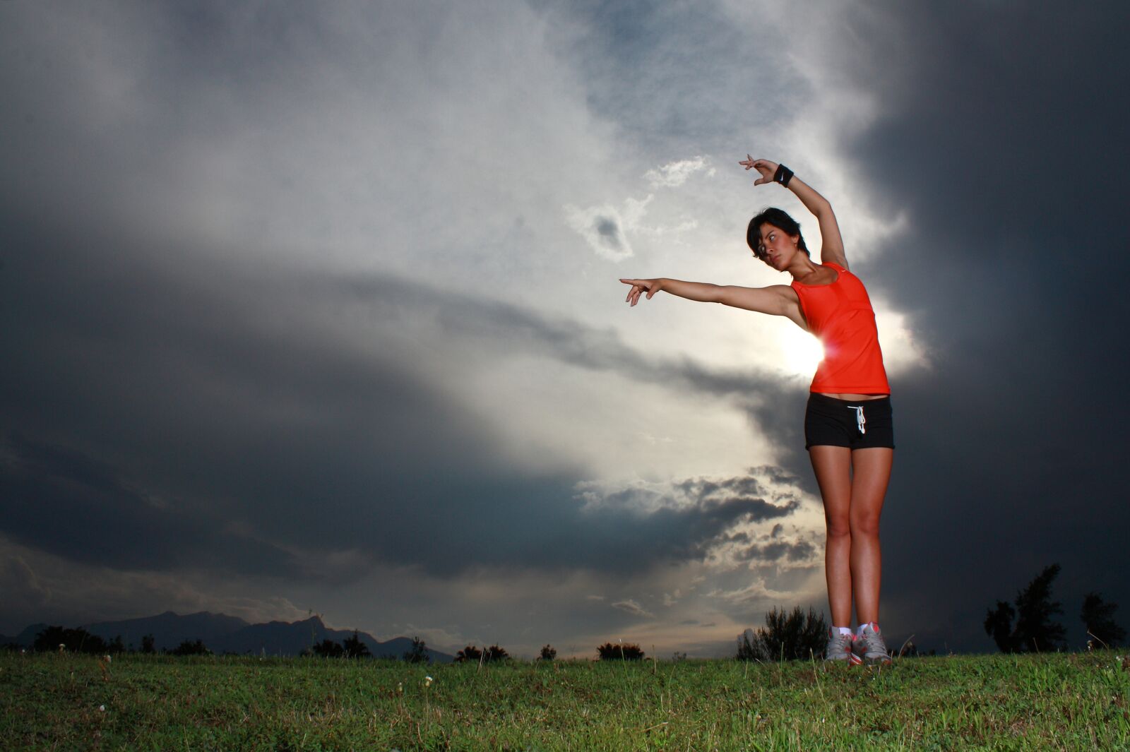 Canon EOS 450D (EOS Rebel XSi / EOS Kiss X2) sample photo. Orange, woman, sports photography