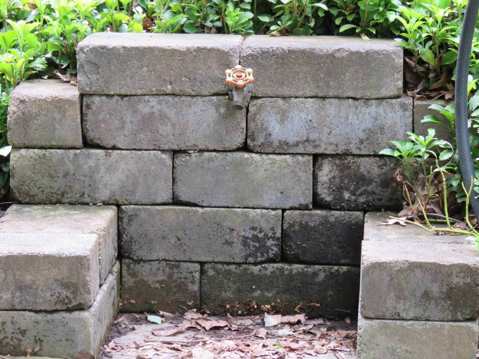 Canon PowerShot SX60 HS sample photo. Watering station in stone photography