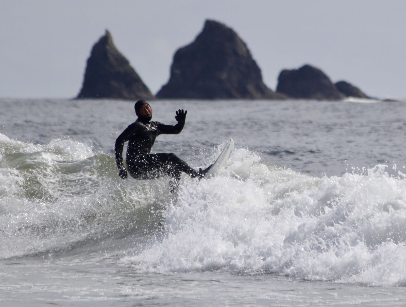Canon EF 70-300mm F4-5.6 IS USM sample photo. Surfer, rocks, beach photography