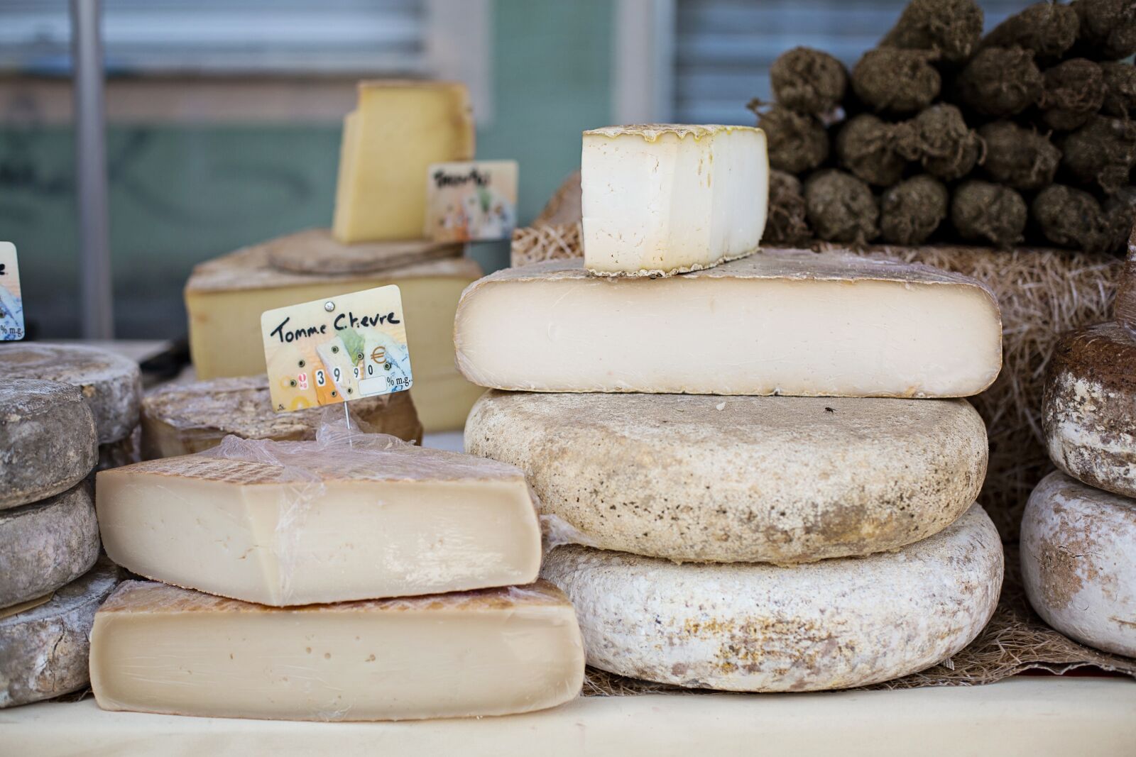 Canon EF 50mm F1.4 USM sample photo. Cheeses, stack of cheeses photography