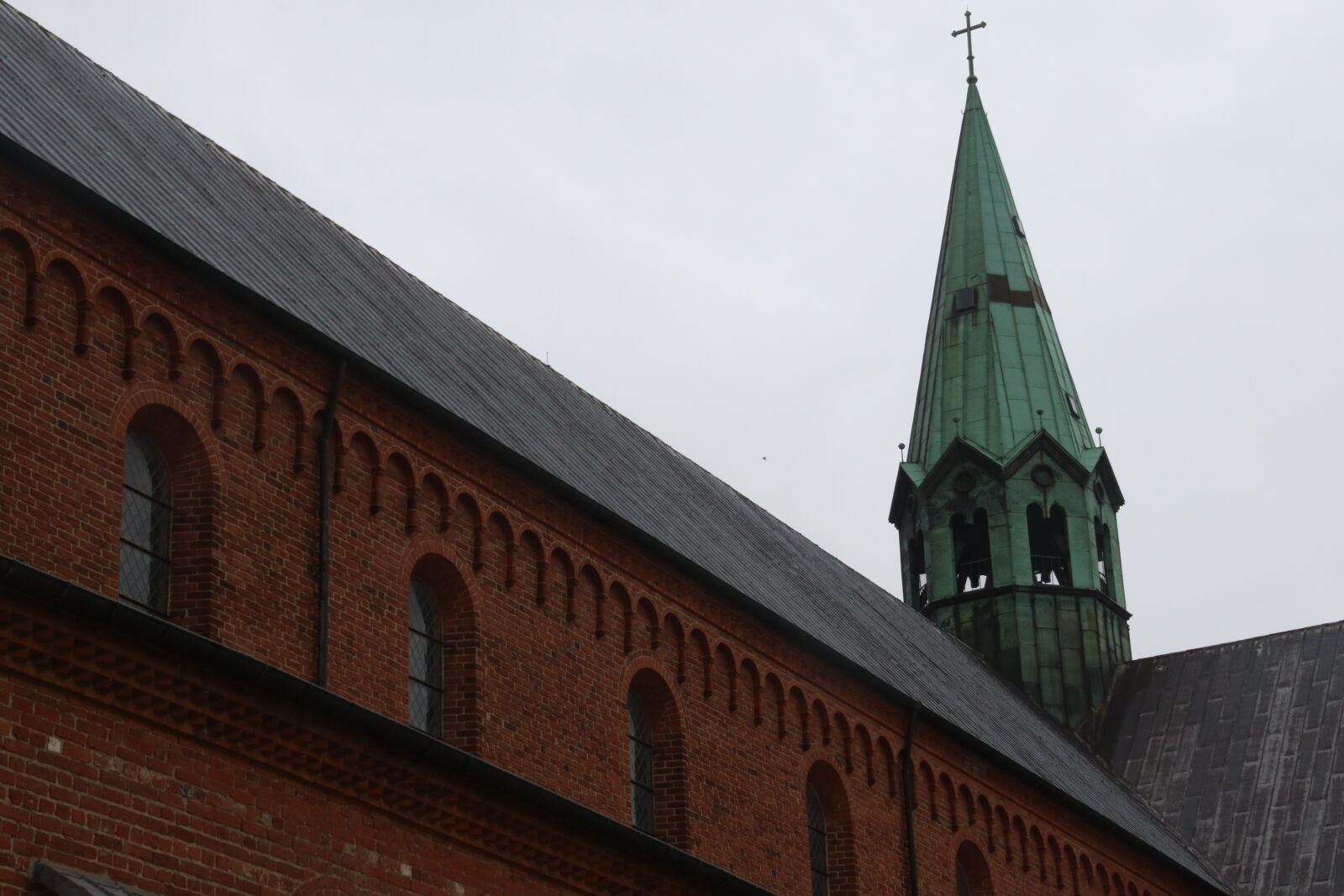Canon EOS 7D Mark II sample photo. Arched, window, bricks, church photography