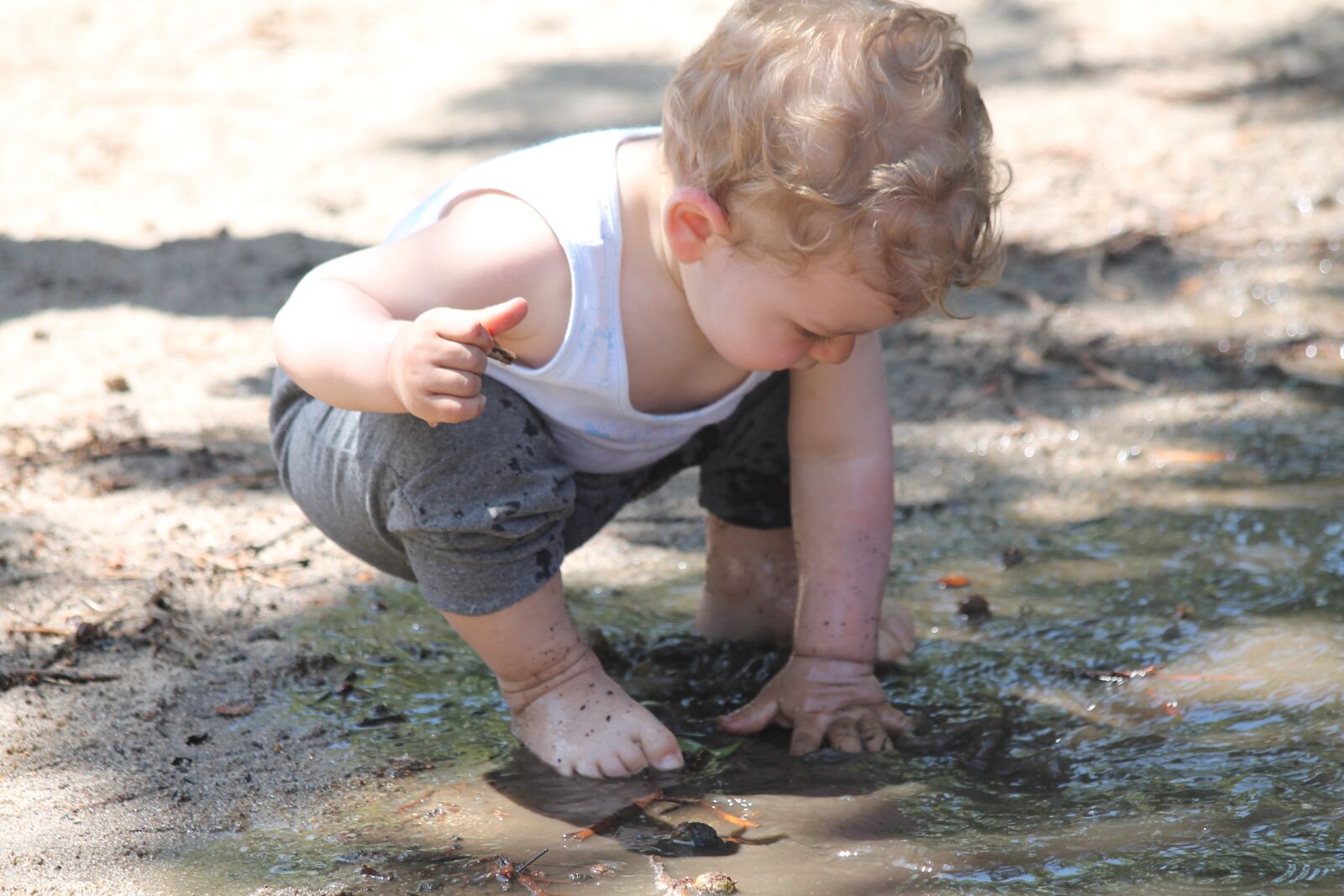 Canon EF 70-300mm F4-5.6 IS USM sample photo. Child, mud, puddle photography