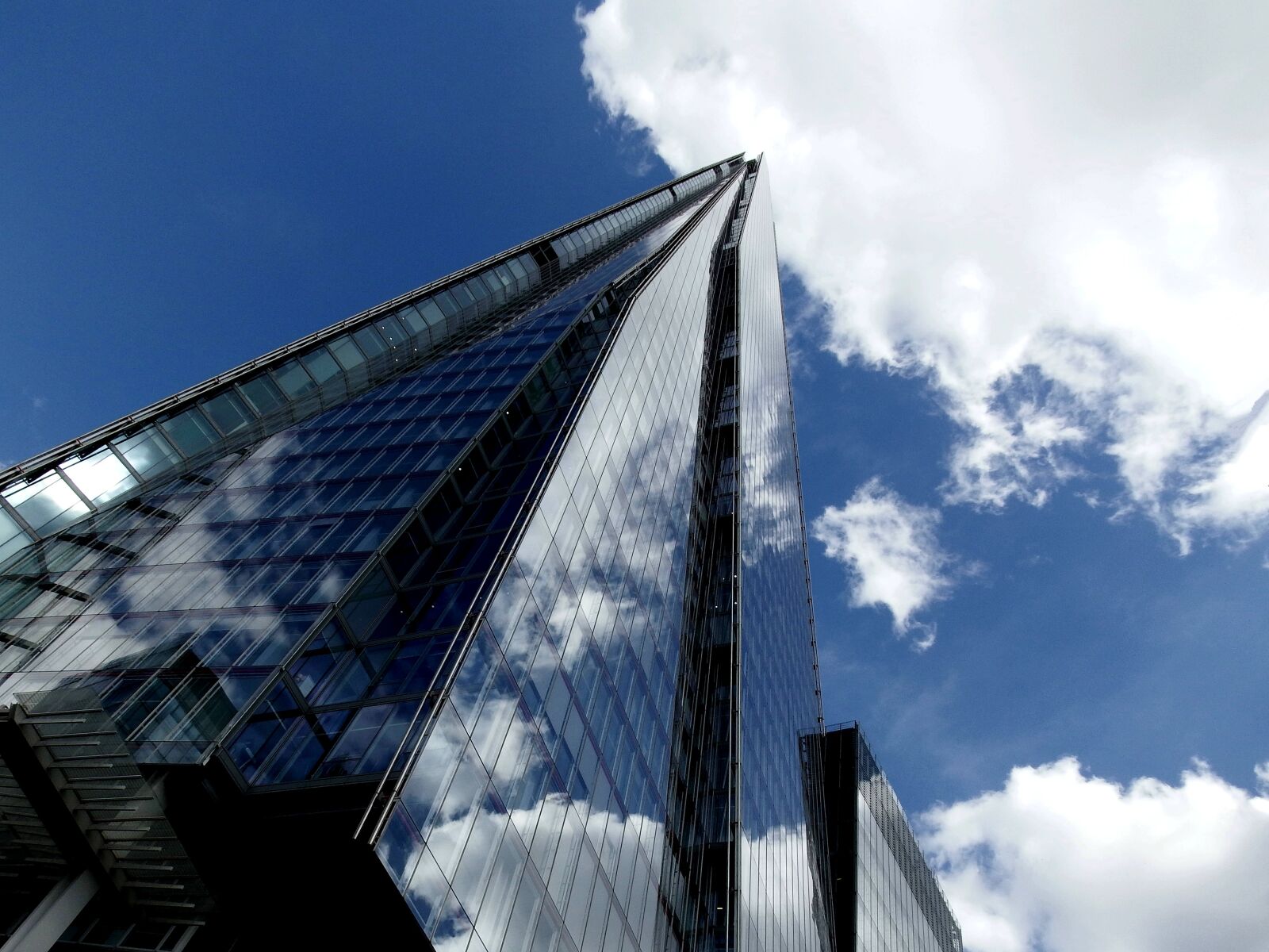 Fujifilm FinePix S1 sample photo. Sky, clouds, skyscraper photography