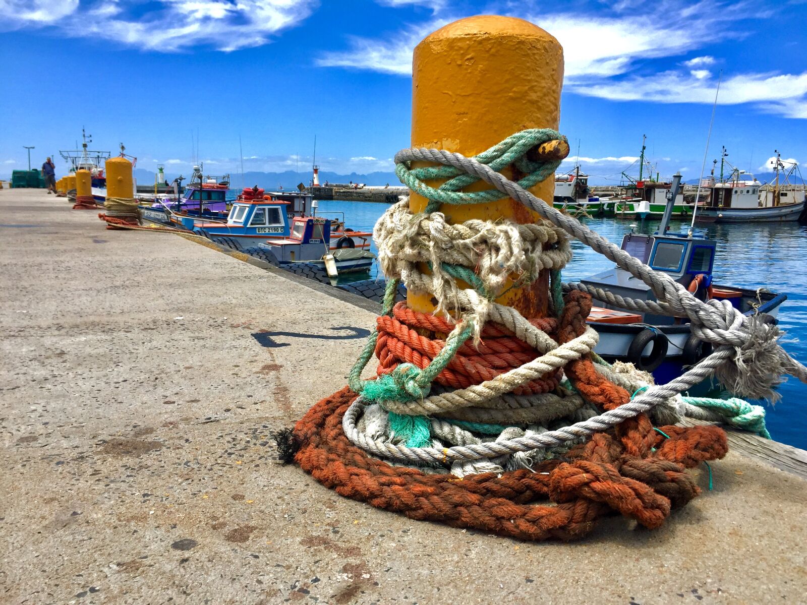 Apple iPhone 6 sample photo. Anchored, blue, sky, boat photography