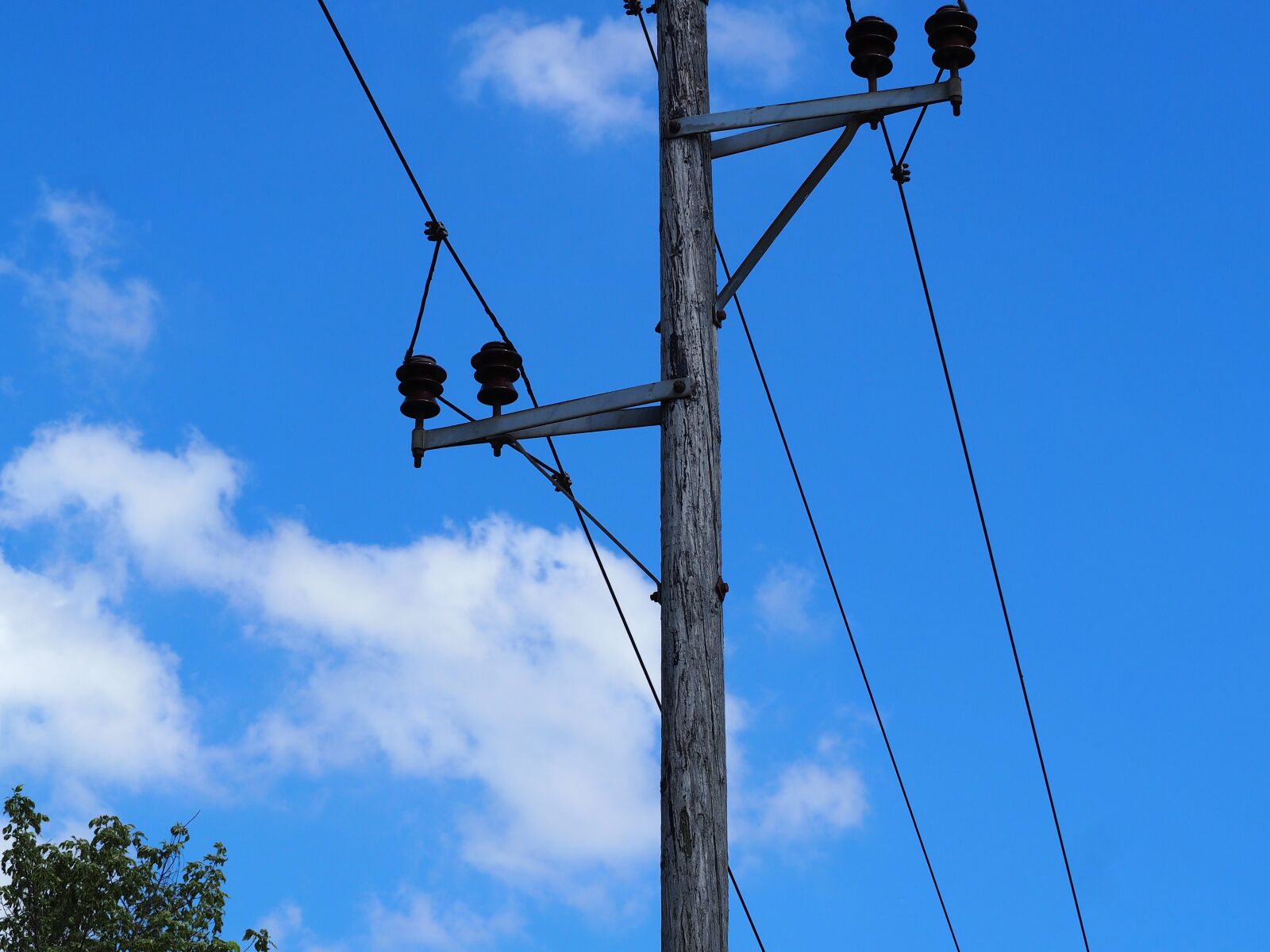 Olympus OM-D E-M10 sample photo. Current, power poles, strommast photography