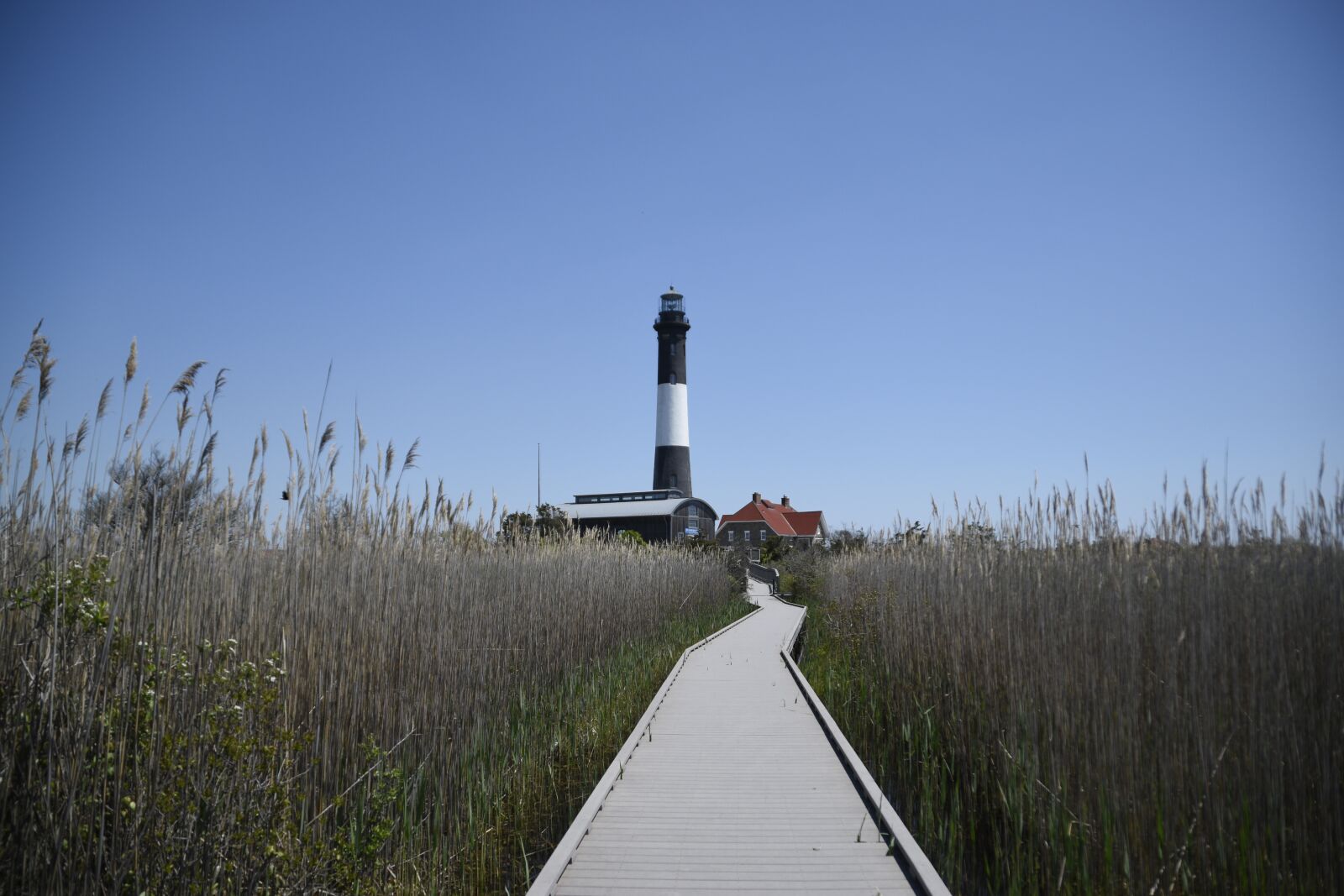 Nikon D5500 sample photo. Lighthouse, walkway, sky photography