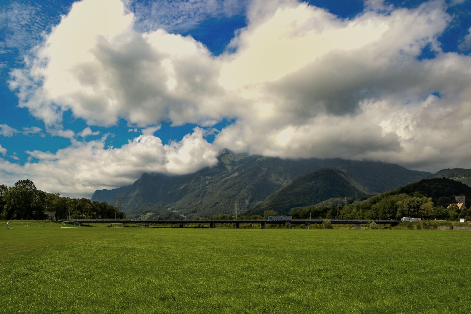 Nikon D3100 sample photo. Clouds, landscape, rheinbrücke photography