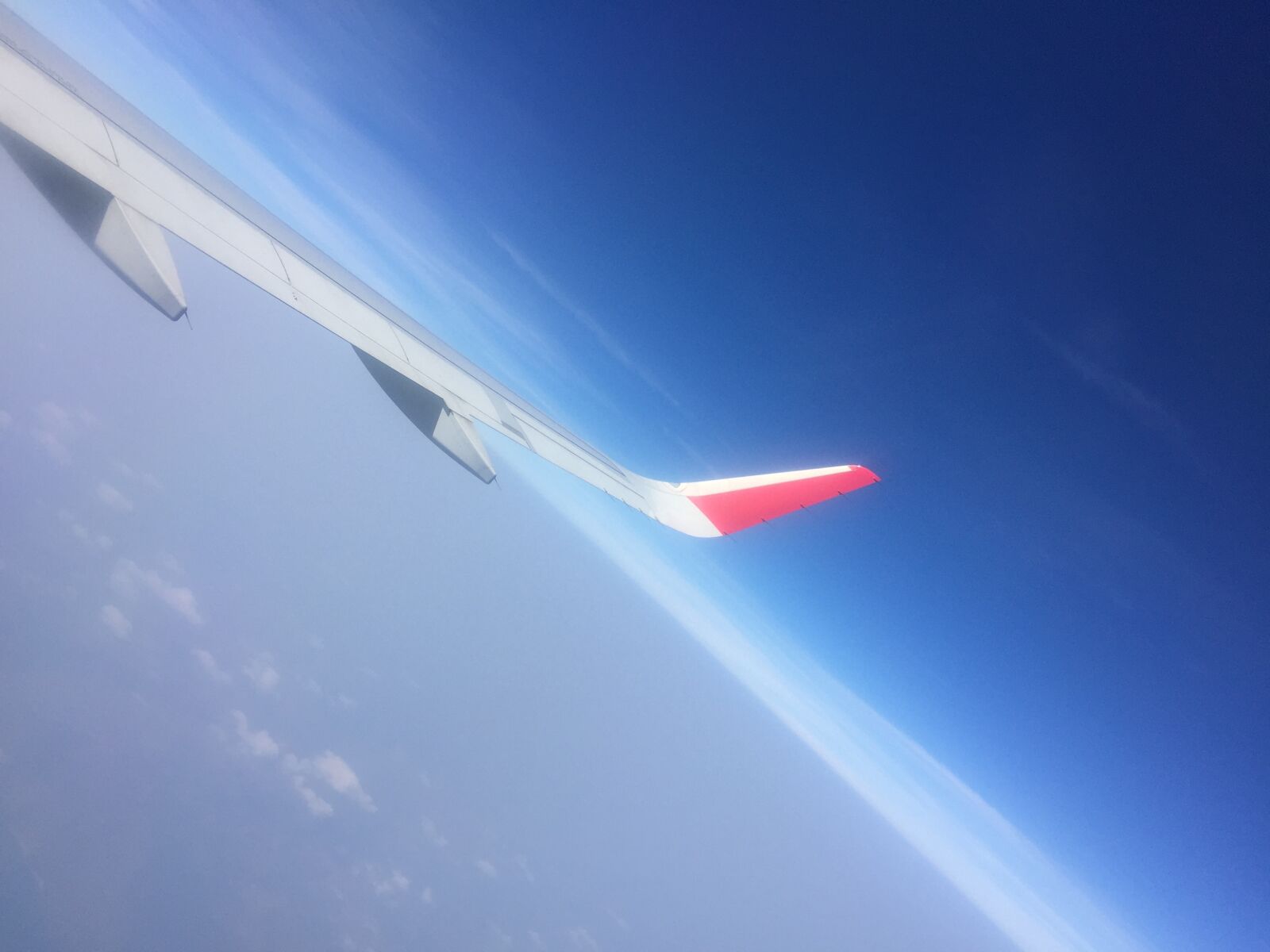 iPhone 6 back camera 4.15mm f/2.2 sample photo. Airplane, blue, sky, cloudy photography