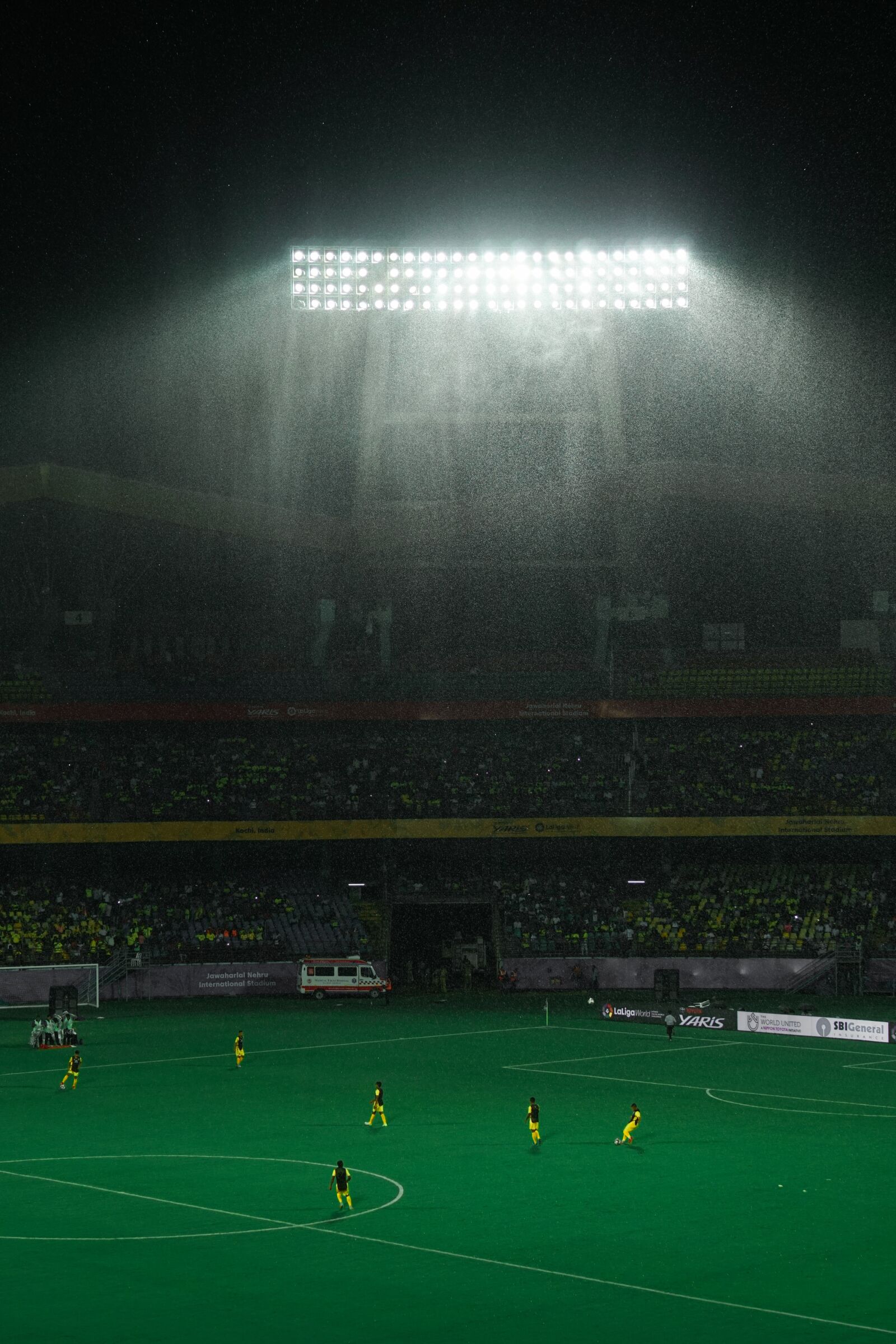 Samyang AF 50mm F1.4 FE sample photo. Football, rain, stadium photography