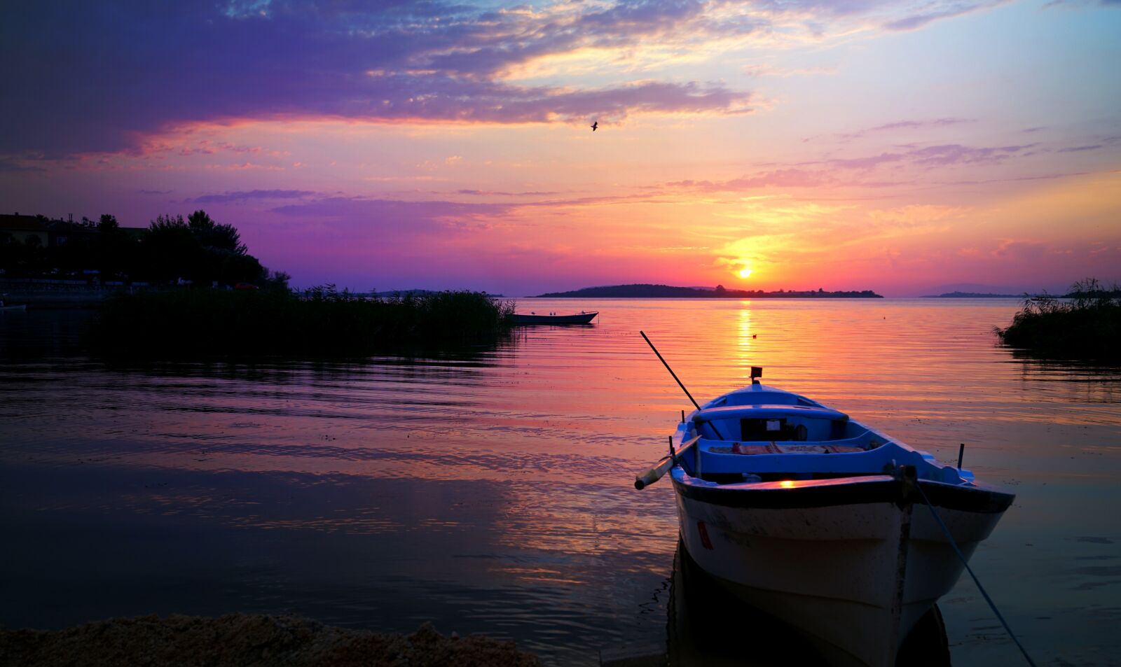 Sony E 16-50mm F3.5-5.6 PZ OSS sample photo. Boat, water, sunset photography