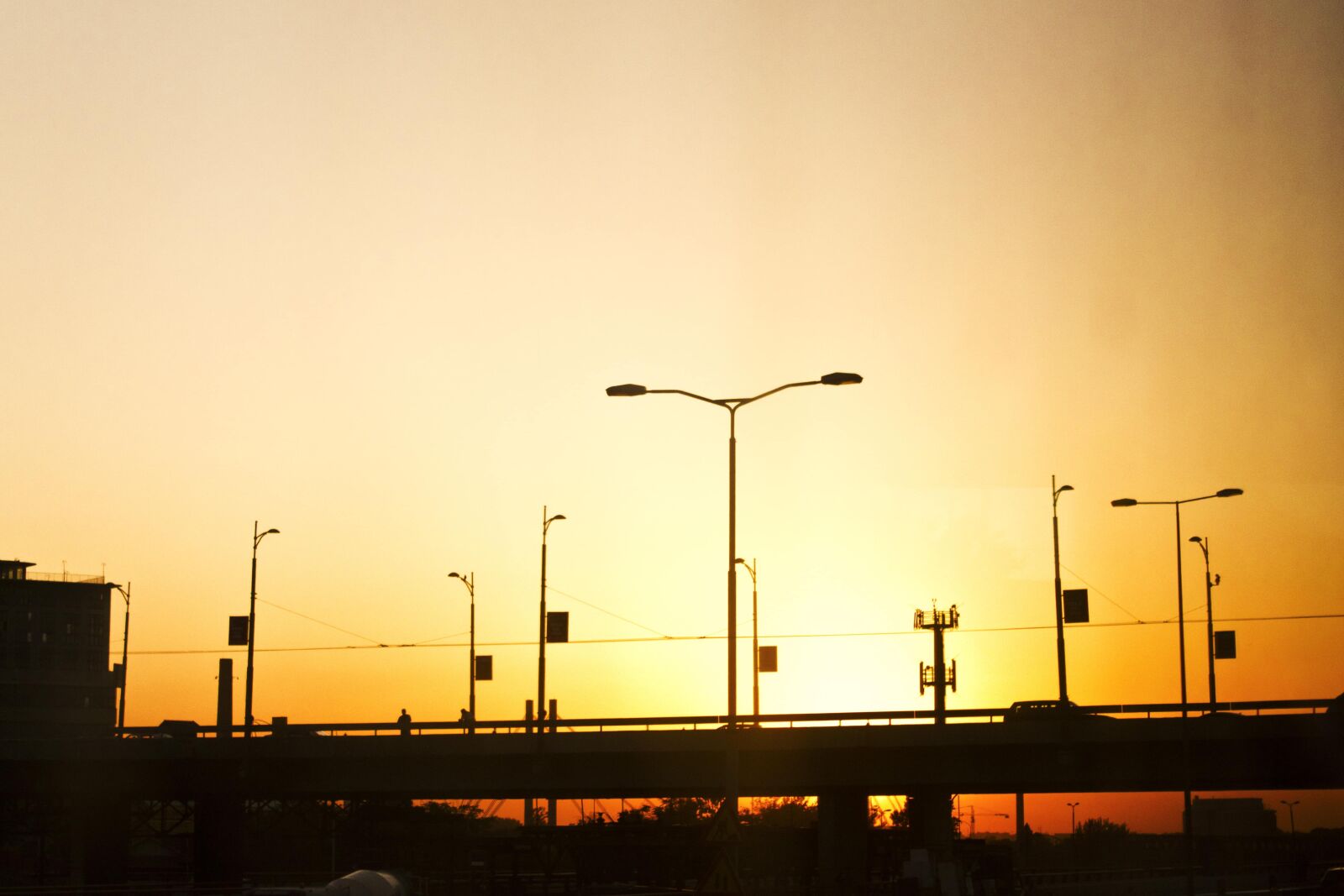 Canon EF-S 18-55mm F3.5-5.6 IS sample photo. Sunset, silhouette, bridge, urban photography