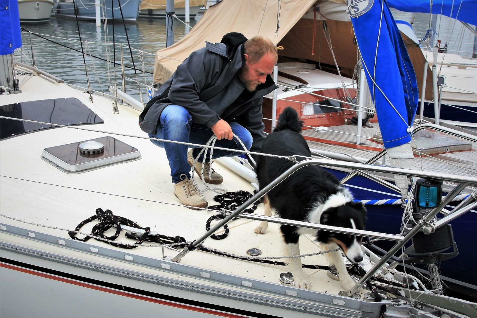 Canon EOS 400D (EOS Digital Rebel XTi / EOS Kiss Digital X) sample photo. Dog, sailboat, transport photography