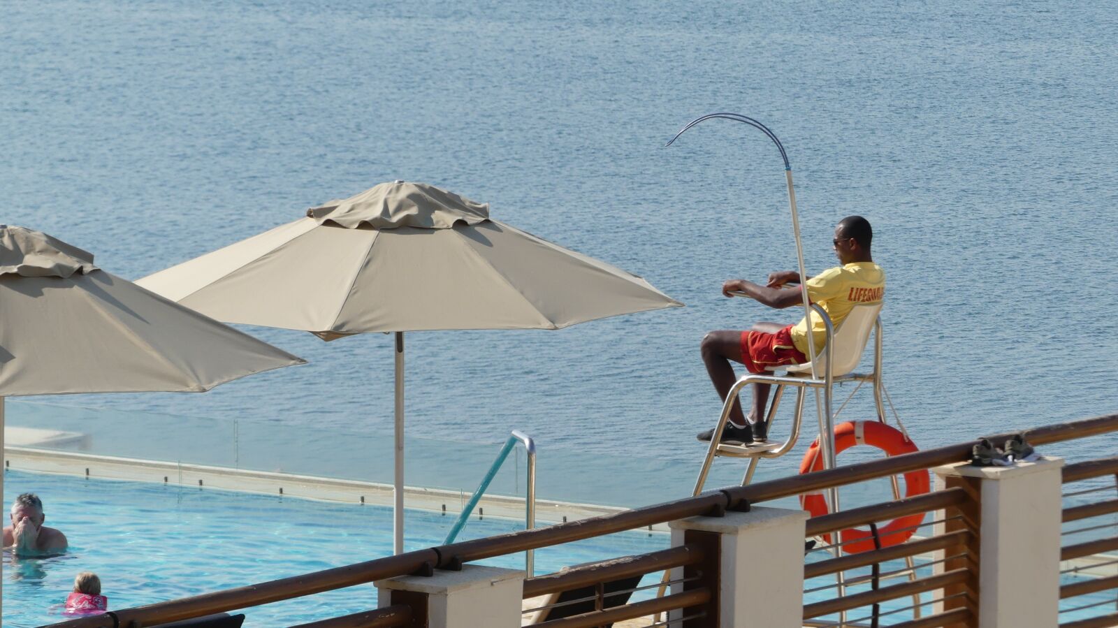 Panasonic Lumix DMC-FZ300 sample photo. Lifeguard, pool, sea photography