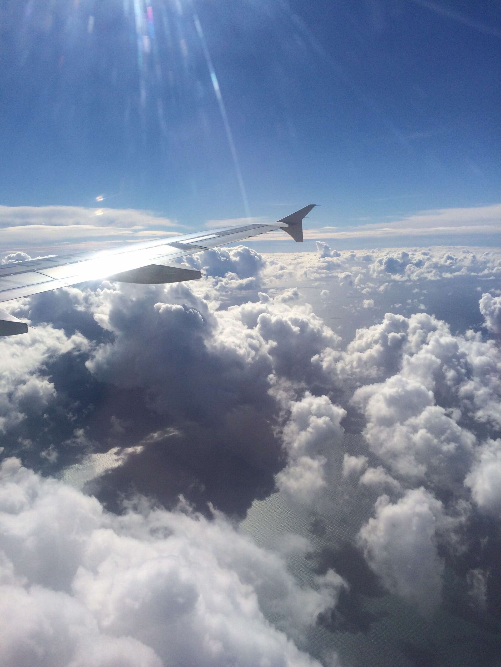 iPhone 5s back camera 4.15mm f/2.2 sample photo. Airplane, clouds, sky photography