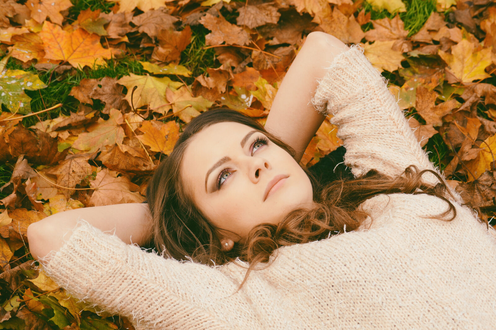 Nikon D3100 sample photo. Woman, in, sweater, laying photography