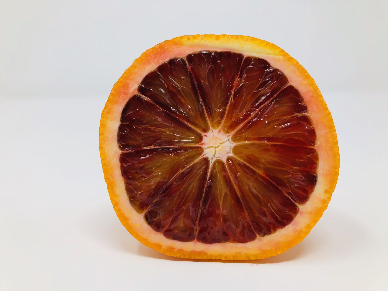iPhone 8 back camera 3.99mm f/1.8 sample photo. Blood orange, half orange photography